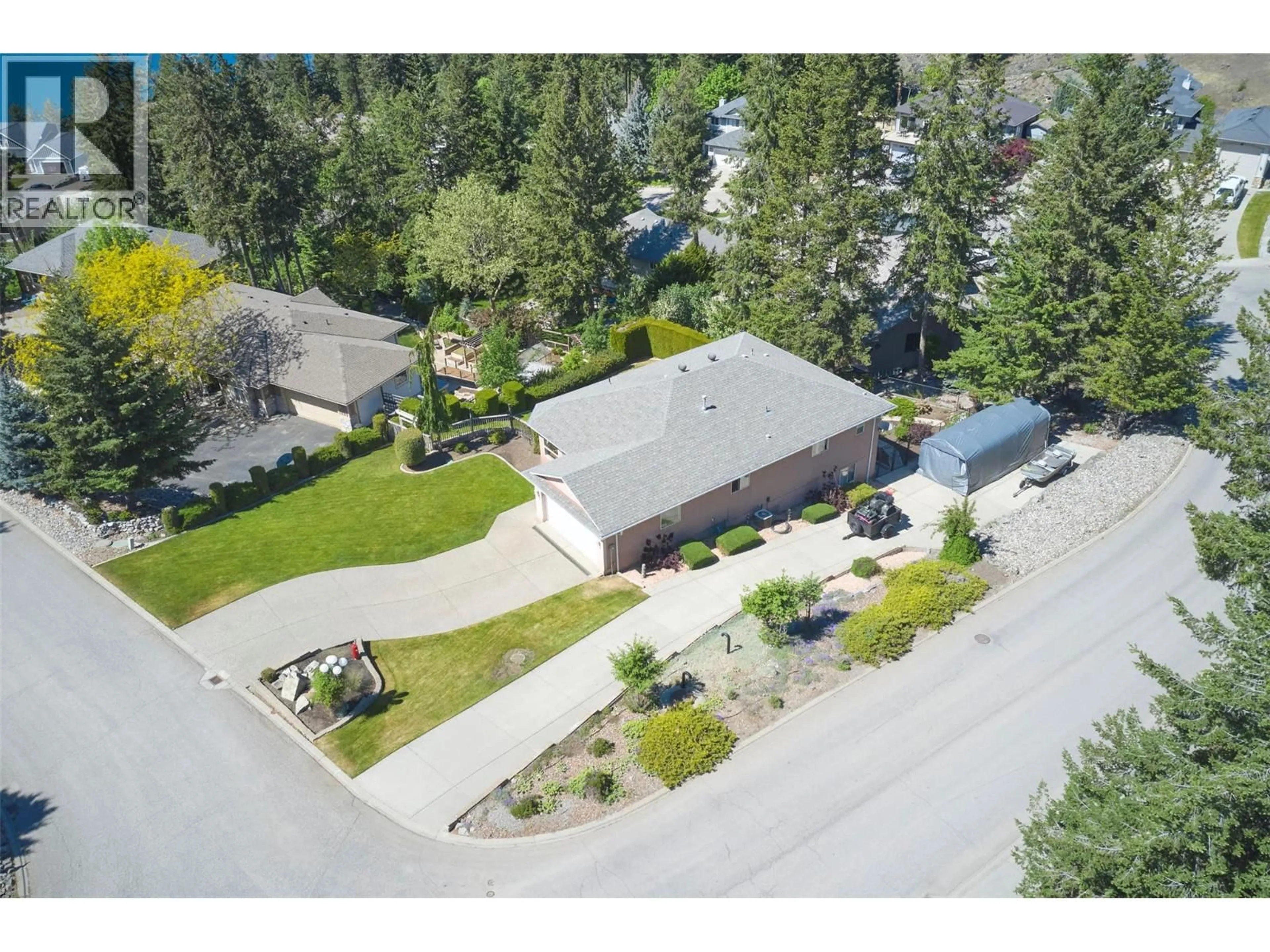 A pic from outside/outdoor area/front of a property/back of a property/a pic from drone, street for 35 PEREGRINE WAY, Vernon British Columbia V1H1E4