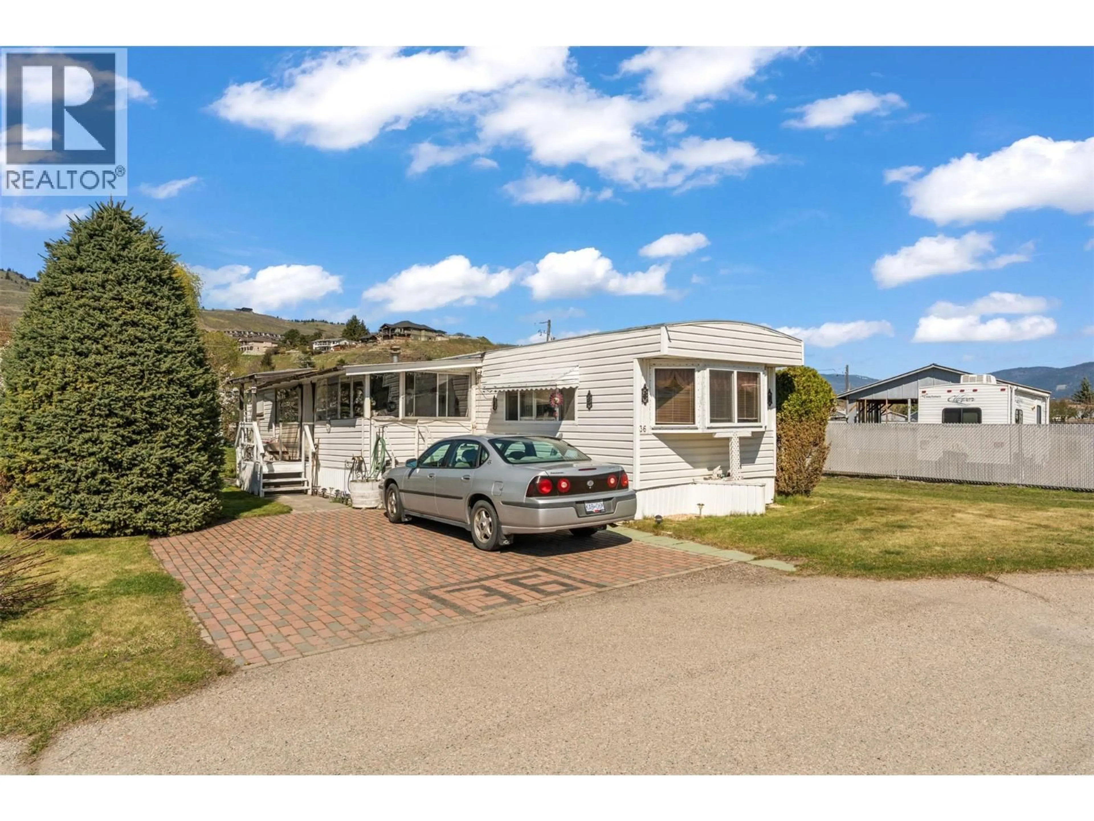 A pic from outside/outdoor area/front of a property/back of a property/a pic from drone, street for 36 - 2727 LAKESHORE ROAD, Vernon British Columbia V1H1X5