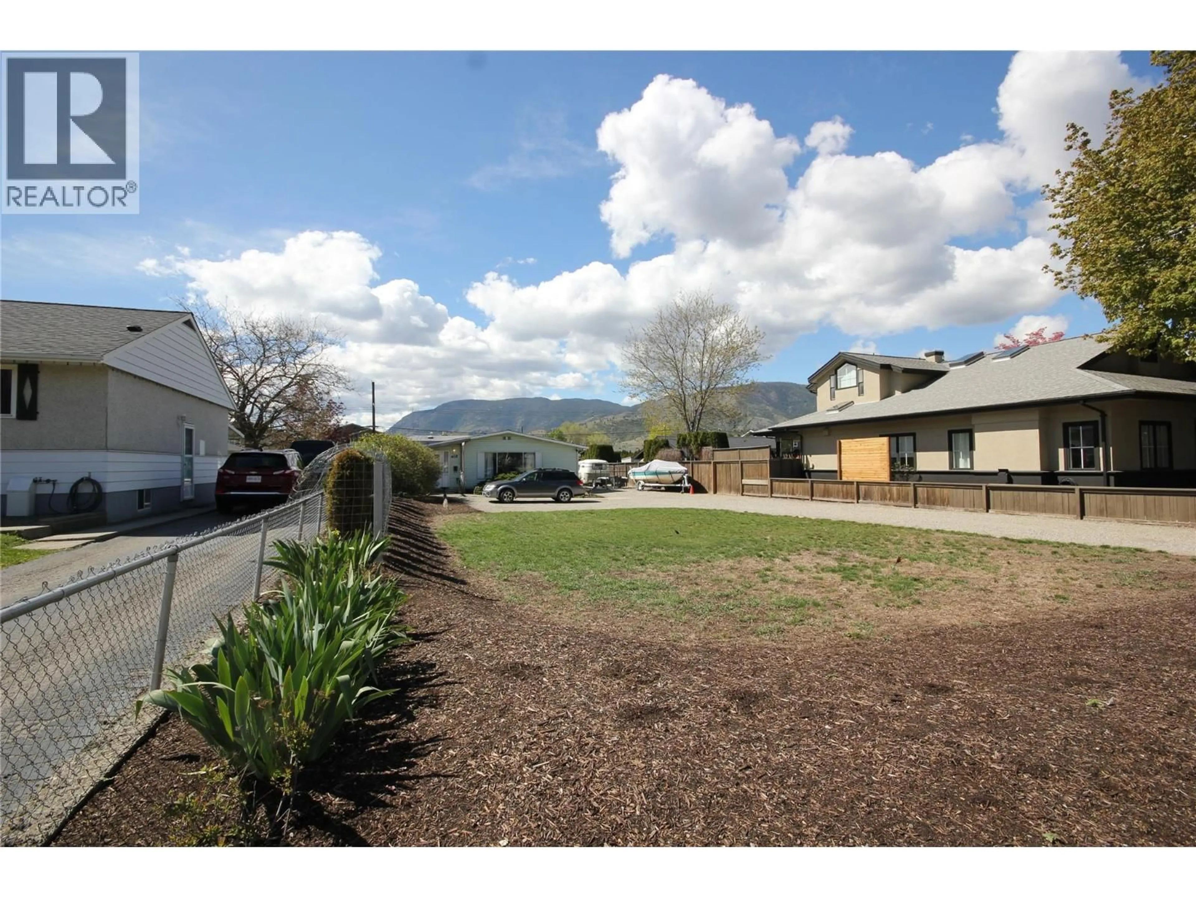 A pic from outside/outdoor area/front of a property/back of a property/a pic from drone, mountain view for 402 CONKLIN AVENUE, Penticton British Columbia V2A2T4
