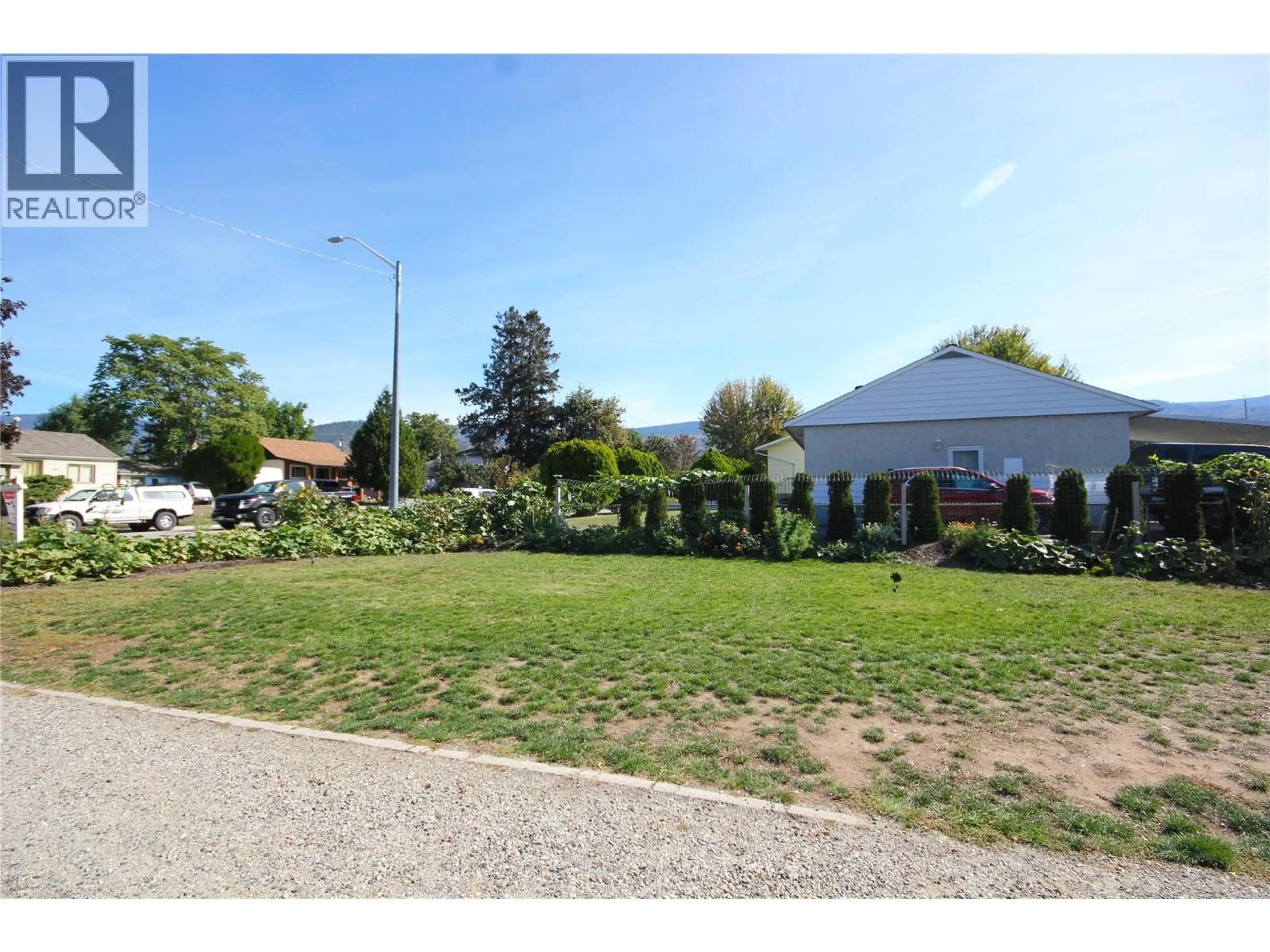 A pic from outside/outdoor area/front of a property/back of a property/a pic from drone, street for 402 CONKLIN AVENUE, Penticton British Columbia V2A2T4