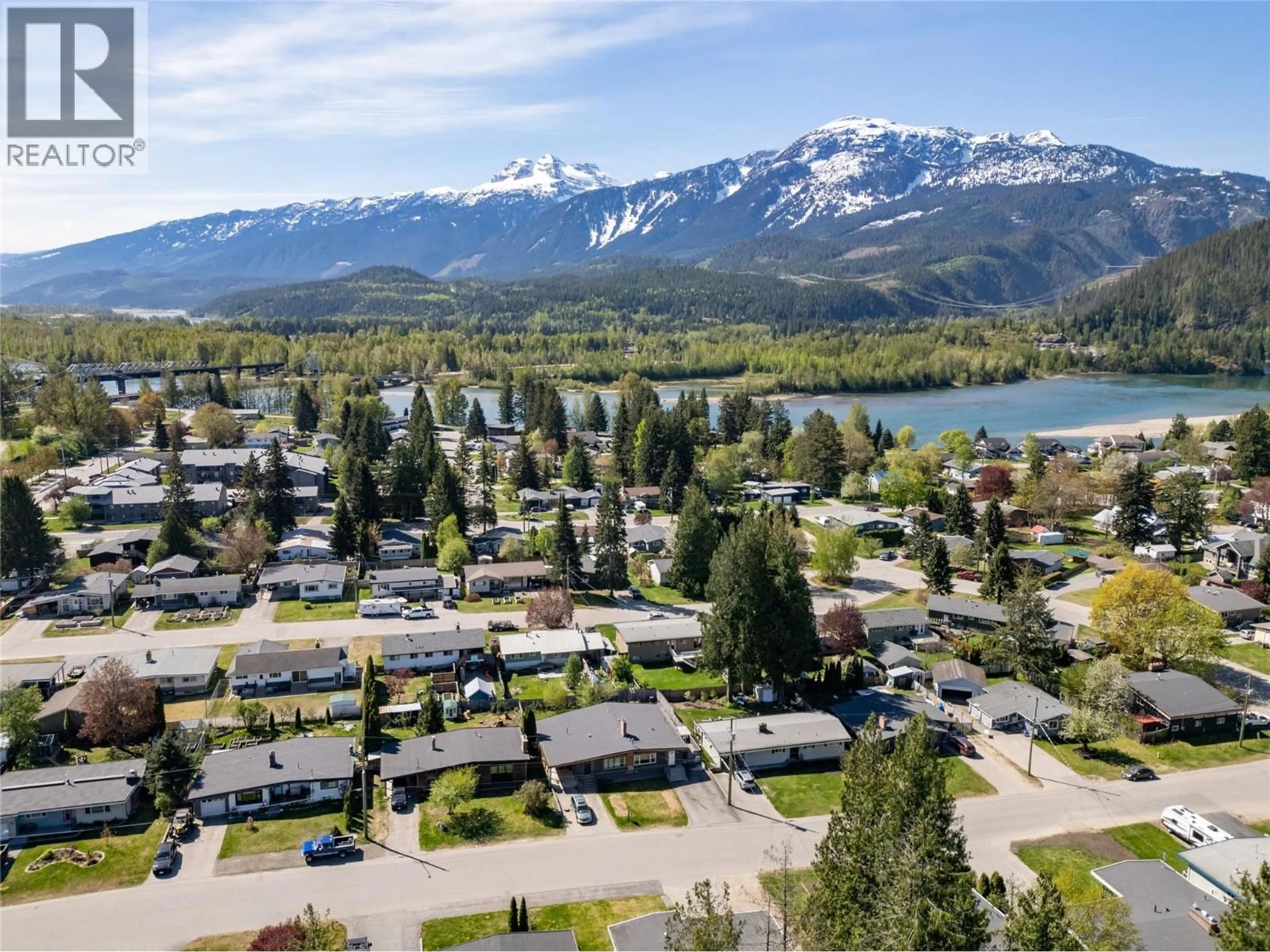 A pic from outside/outdoor area/front of a property/back of a property/a pic from drone, mountain view for B - 1971 FAIRWAY ROAD, Revelstoke British Columbia V0E2S0
