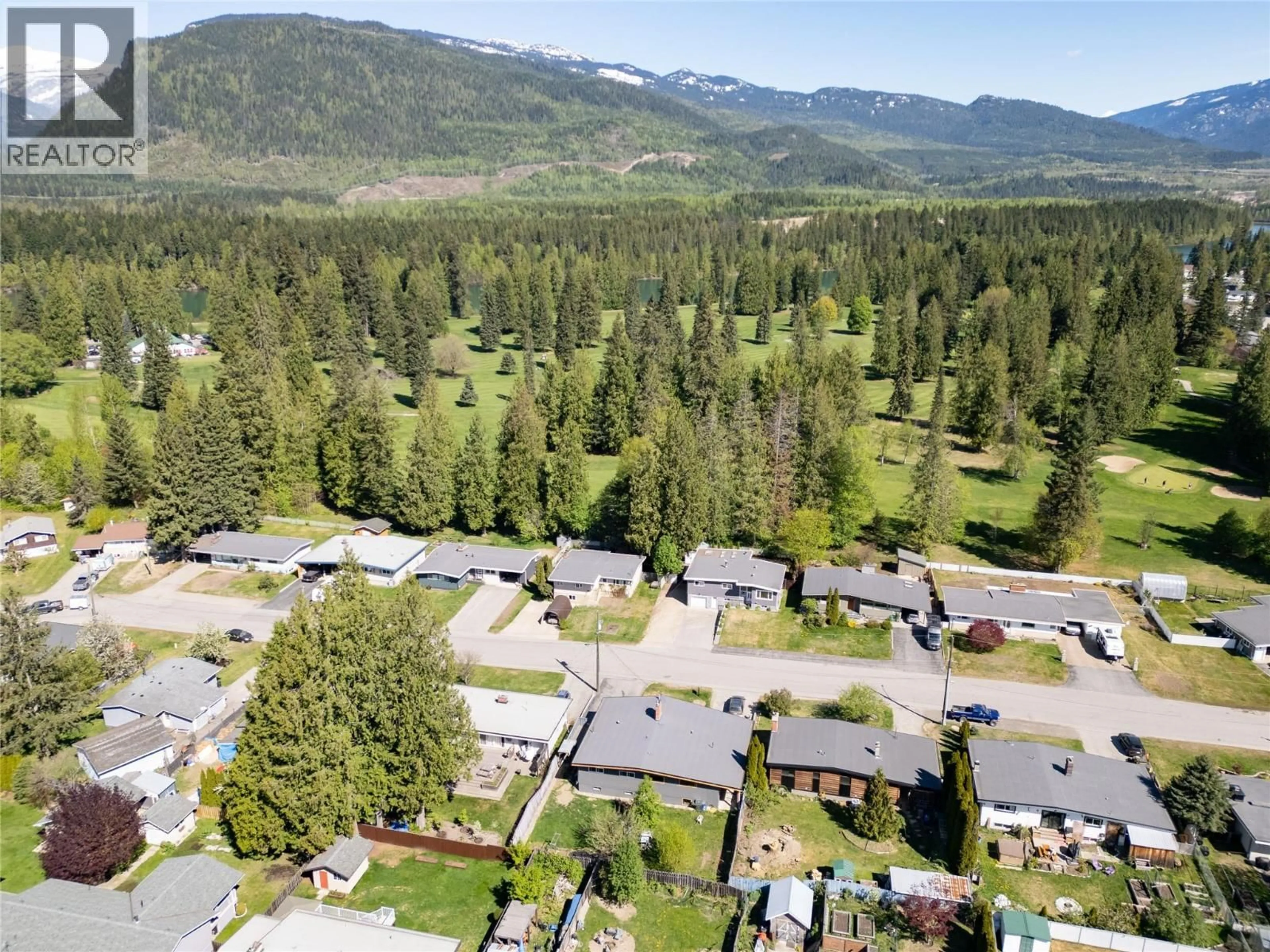 A pic from outside/outdoor area/front of a property/back of a property/a pic from drone, mountain view for B - 1971 FAIRWAY ROAD, Revelstoke British Columbia V0E2S0