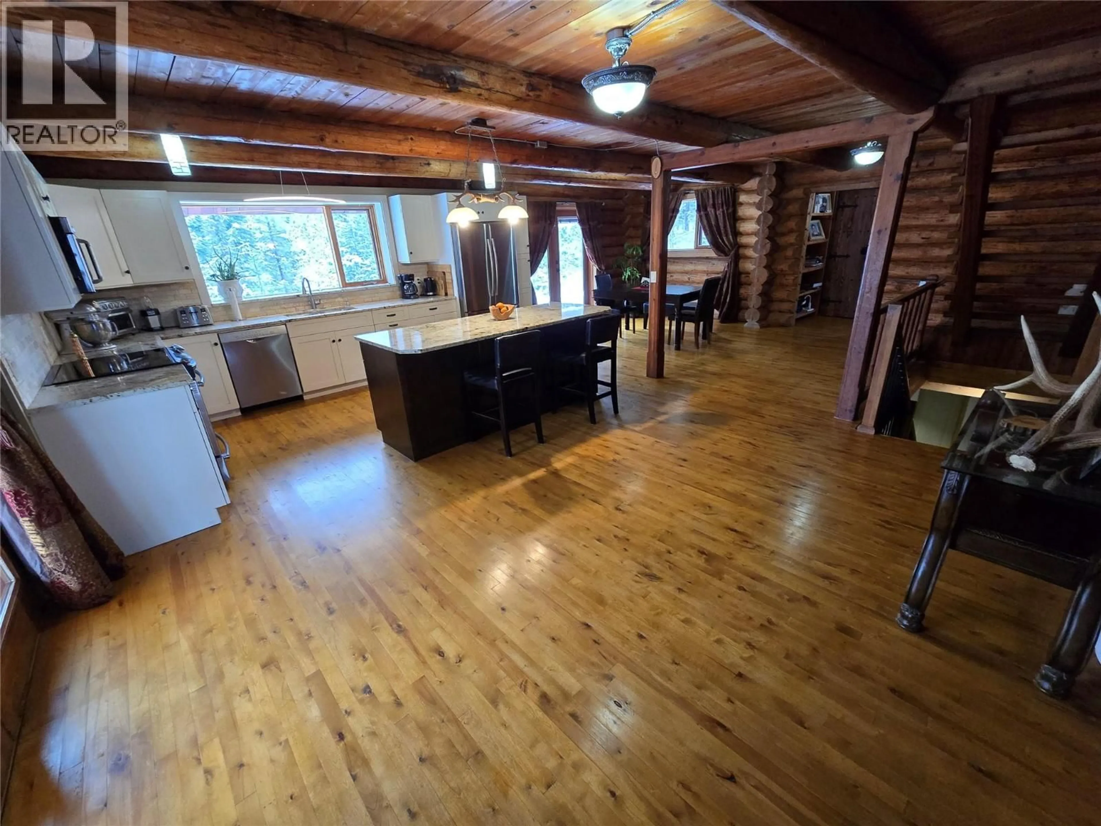 Open concept kitchen, wood/laminate floor for 2358 DUNN LAKE ROAD, Clearwater British Columbia V0E1N0
