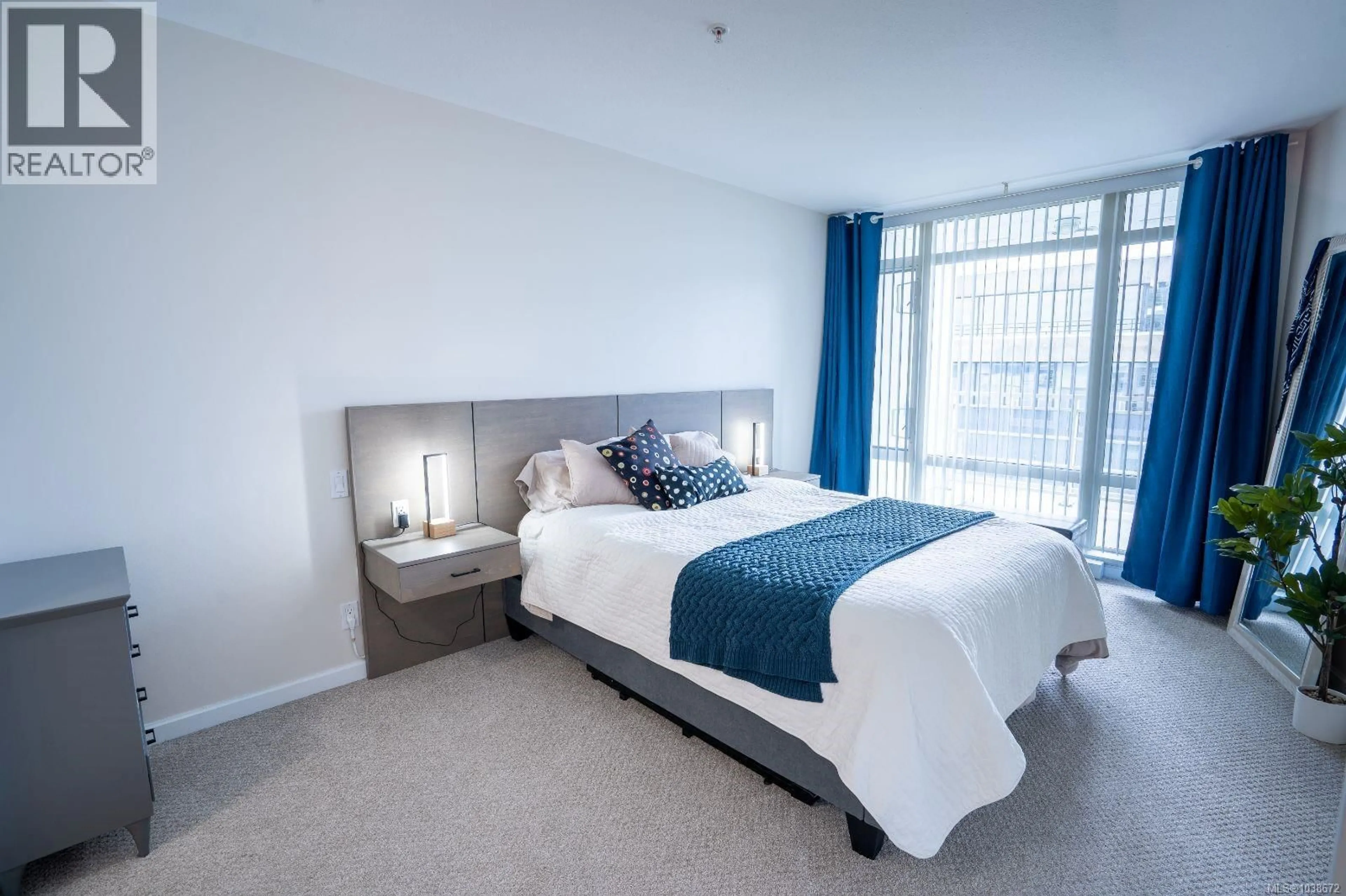 Bedroom with bed, carpet floor for 504 - 38 FRONT STREET, Nanaimo British Columbia V9R0B8