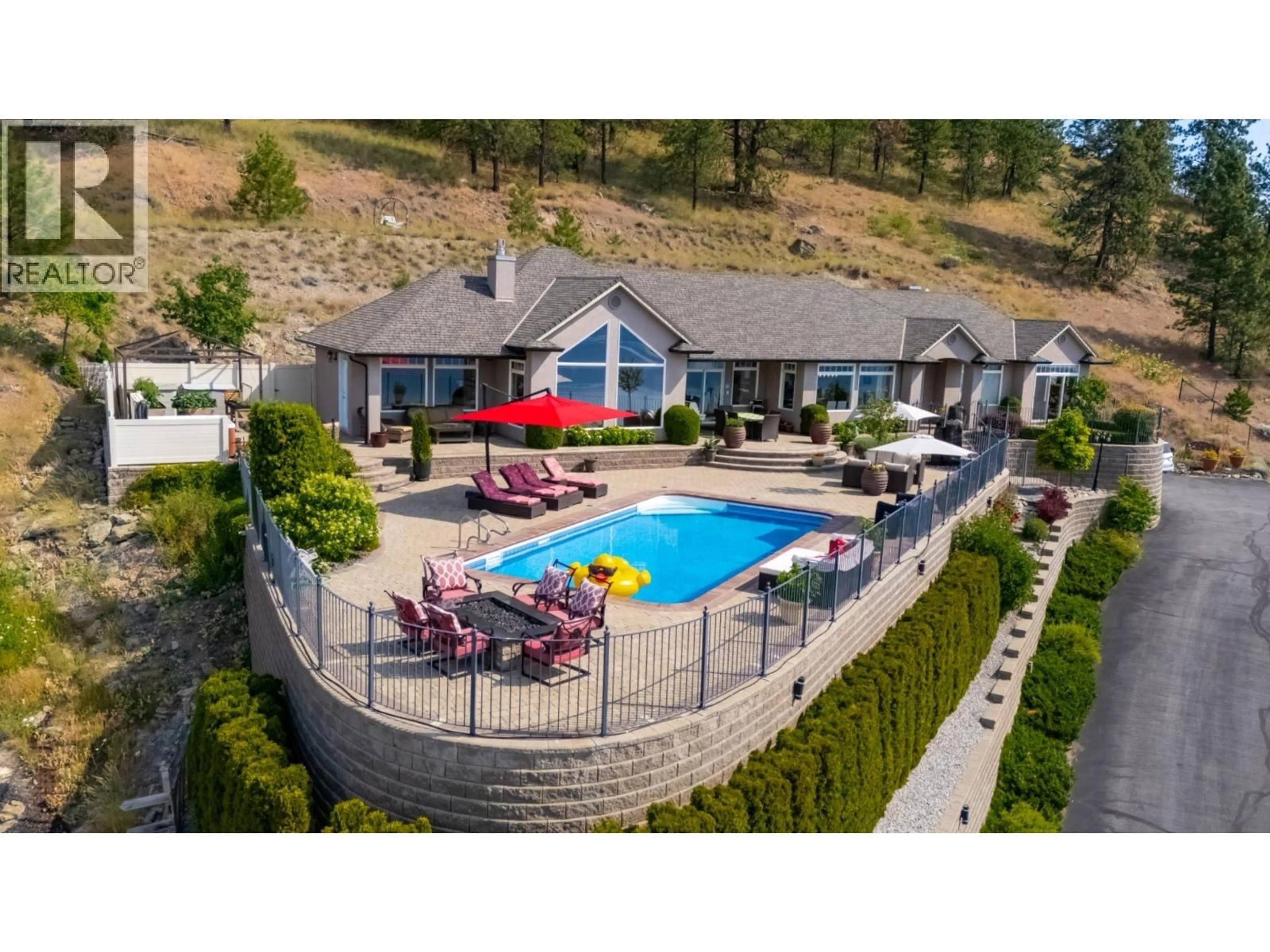 A pic from outside/outdoor area/front of a property/back of a property/a pic from drone, mountain view for 1260 TIMOTHY PLACE, West Kelowna British Columbia V1Z3N2