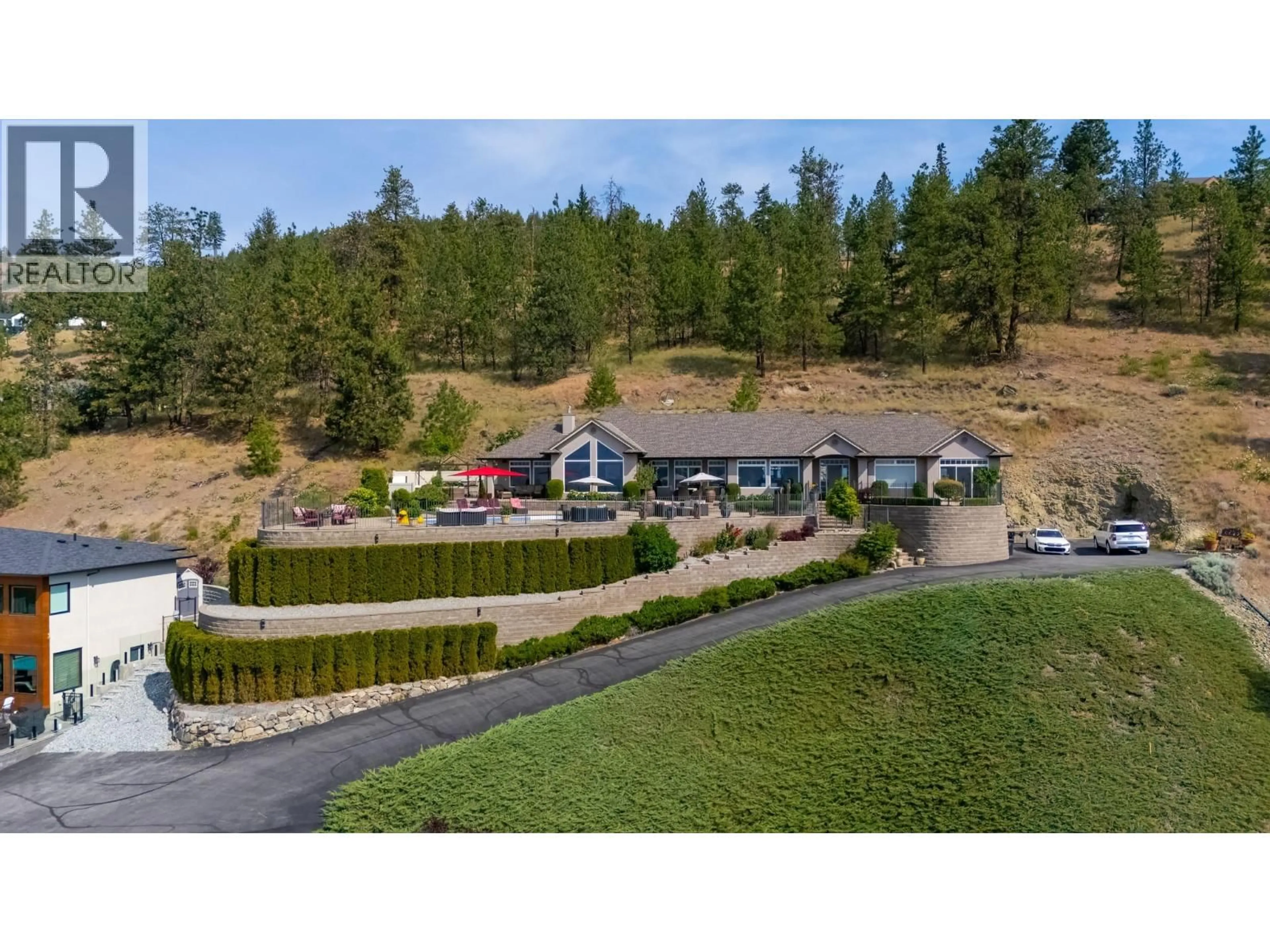A pic from outside/outdoor area/front of a property/back of a property/a pic from drone, mountain view for 1260 TIMOTHY PLACE, West Kelowna British Columbia V1Z3N2