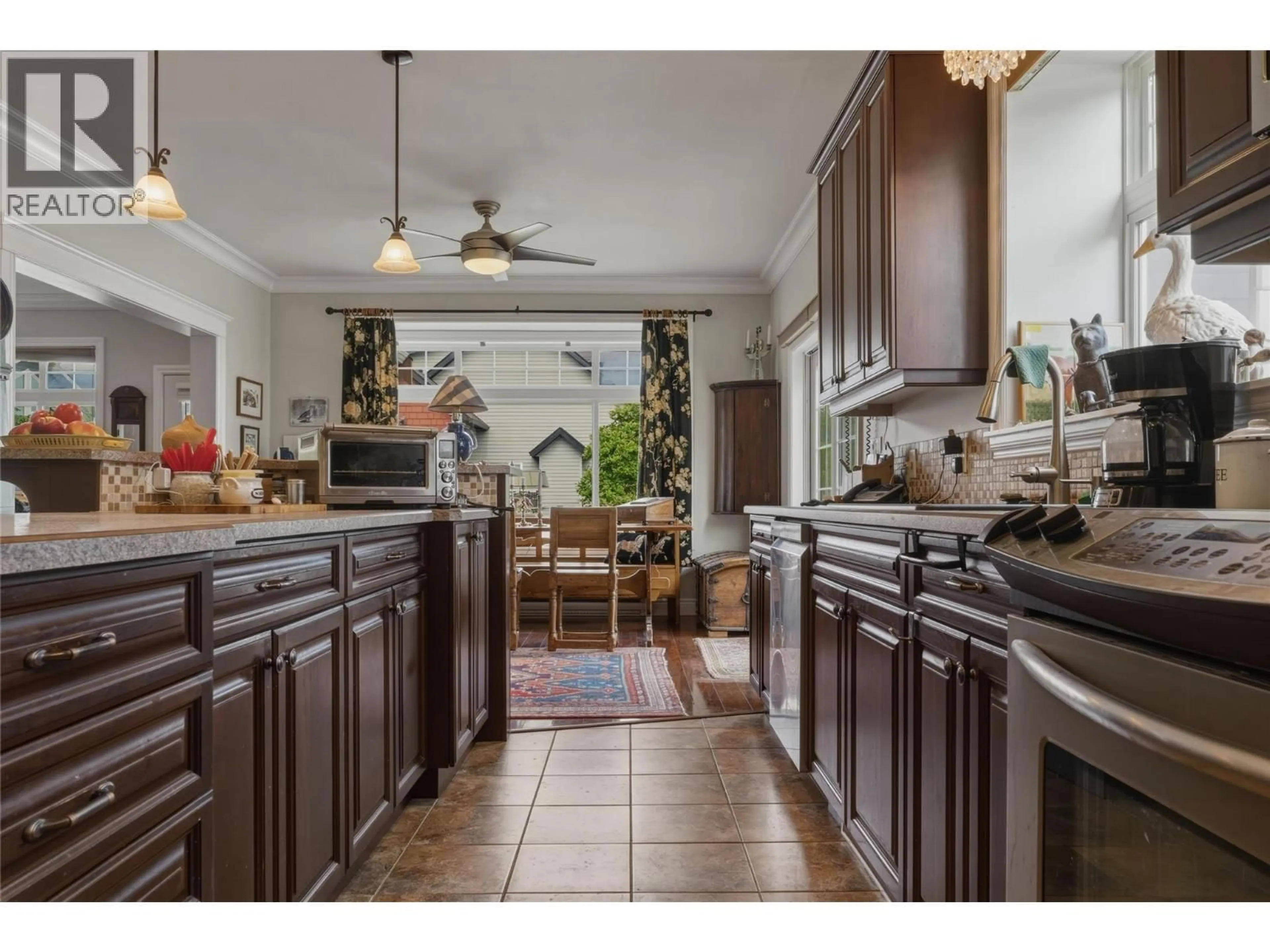 Open concept kitchen, ceramic/tile floor for 240 GROUSE AVENUE, Vernon British Columbia V1H2A1