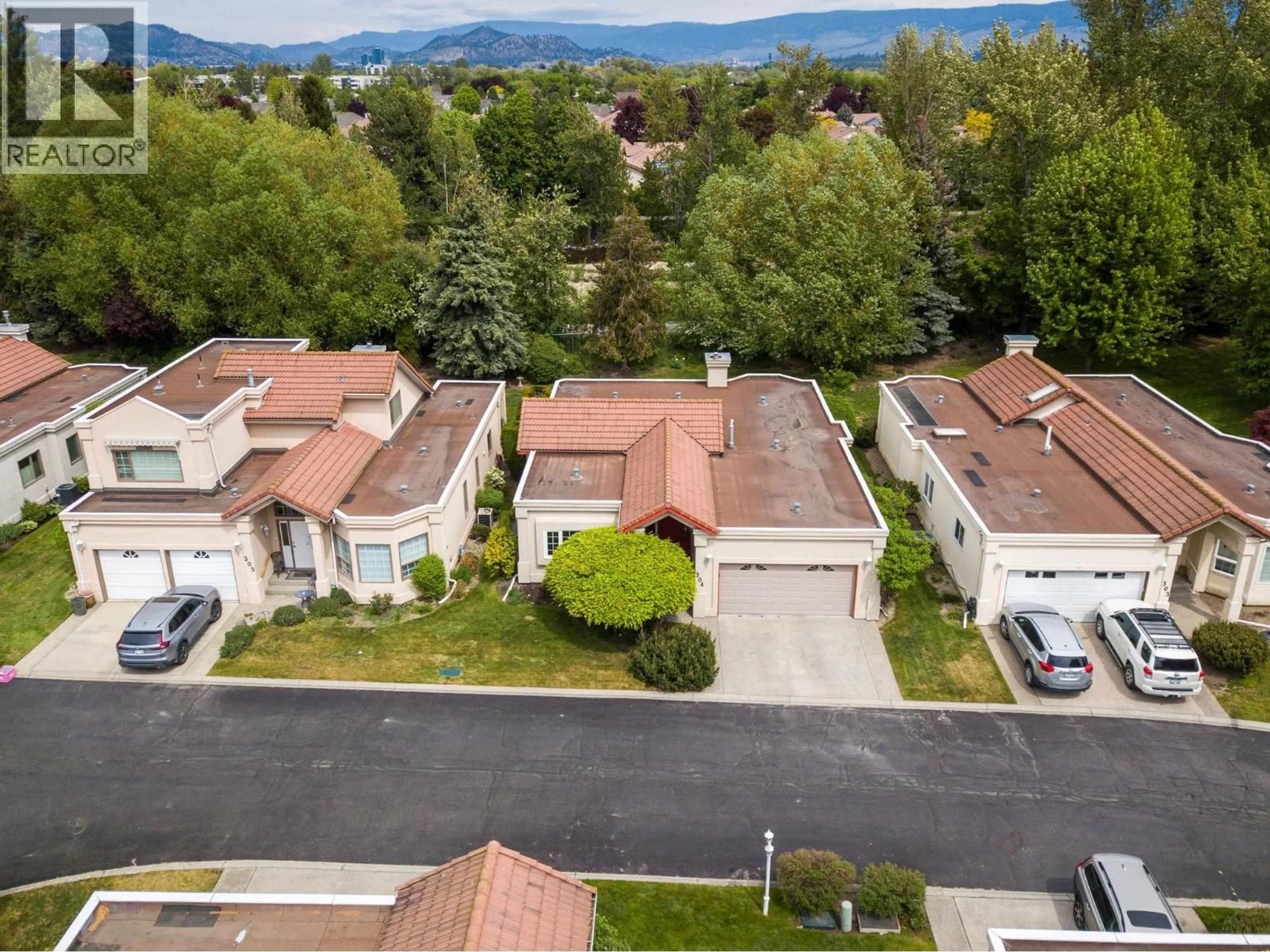 A pic from outside/outdoor area/front of a property/back of a property/a pic from drone, mountain view for 304 - 650 LEXINGTON DRIVE, Kelowna British Columbia V1W3B6
