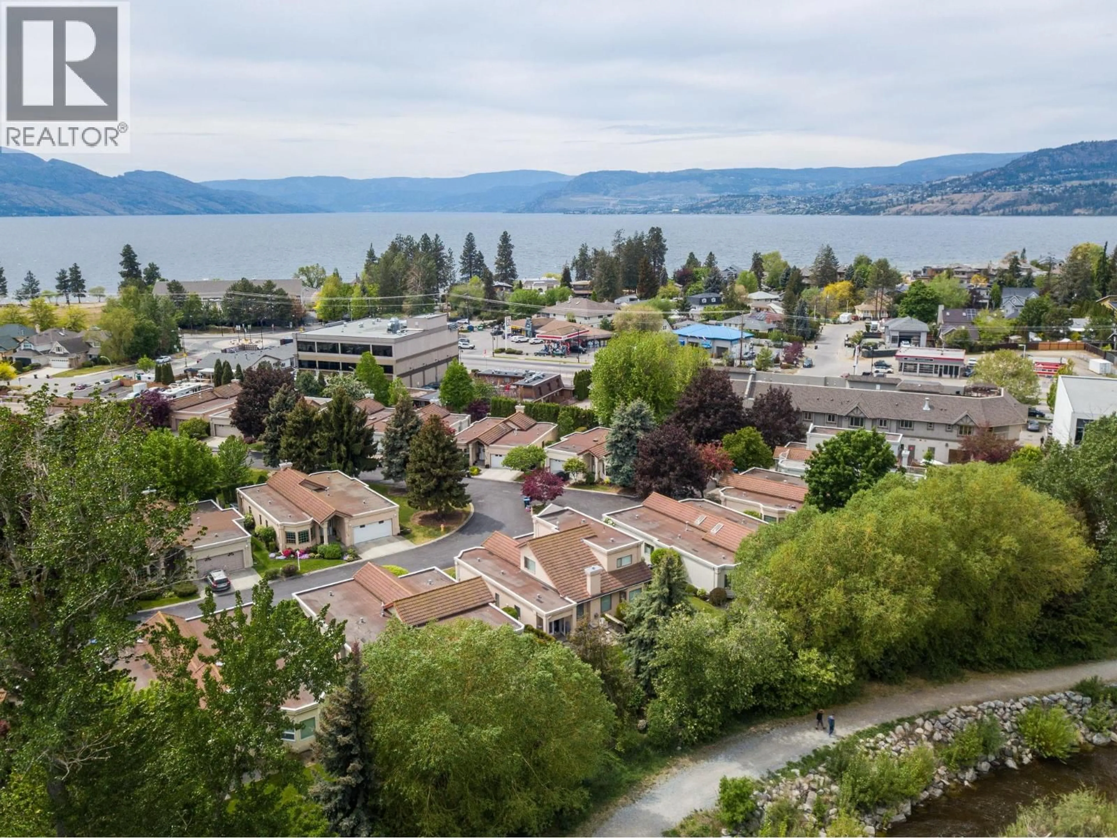 A pic from outside/outdoor area/front of a property/back of a property/a pic from drone, water/lake/river/ocean view for 304 - 650 LEXINGTON DRIVE, Kelowna British Columbia V1W3B6