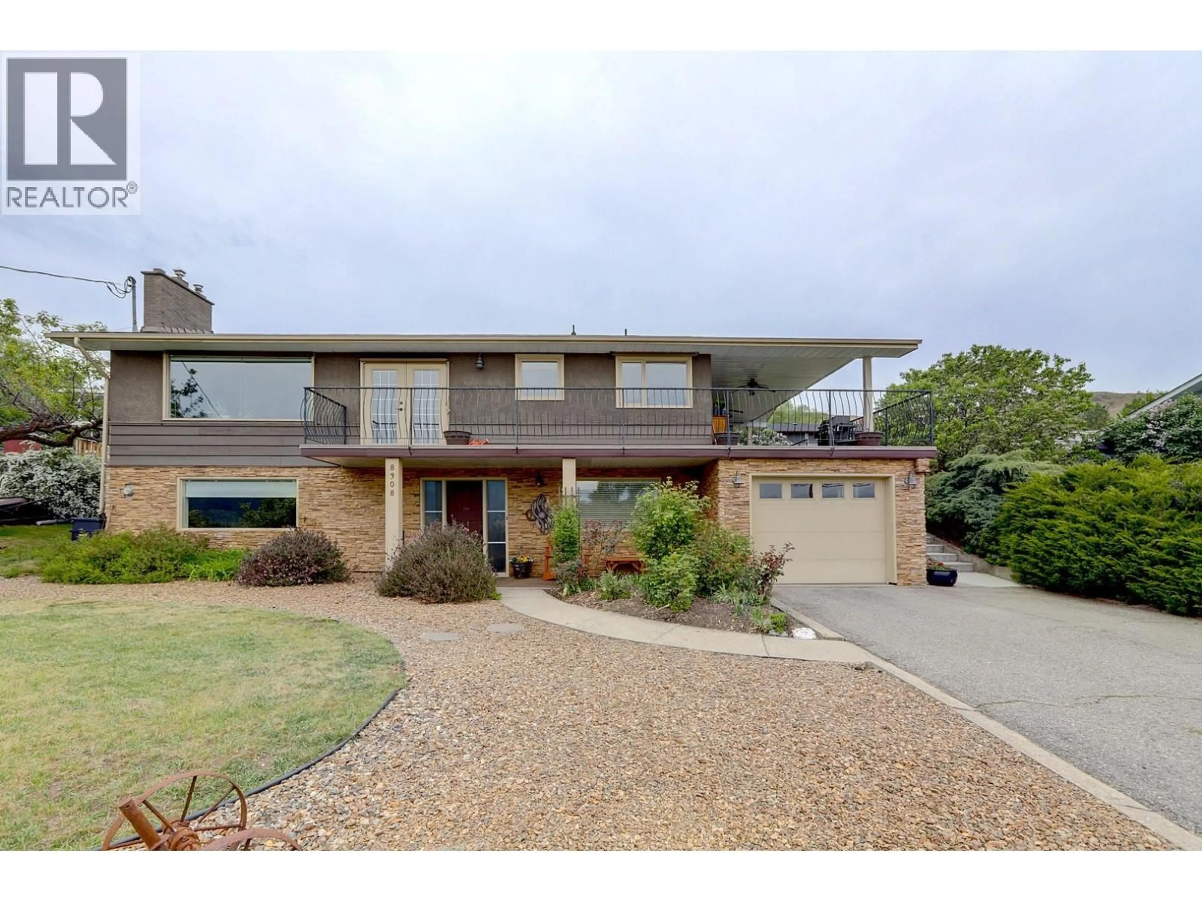 A pic from outside/outdoor area/front of a property/back of a property/a pic from drone, street for 8308 KALVIEW DRIVE, Coldstream British Columbia V1B1W7
