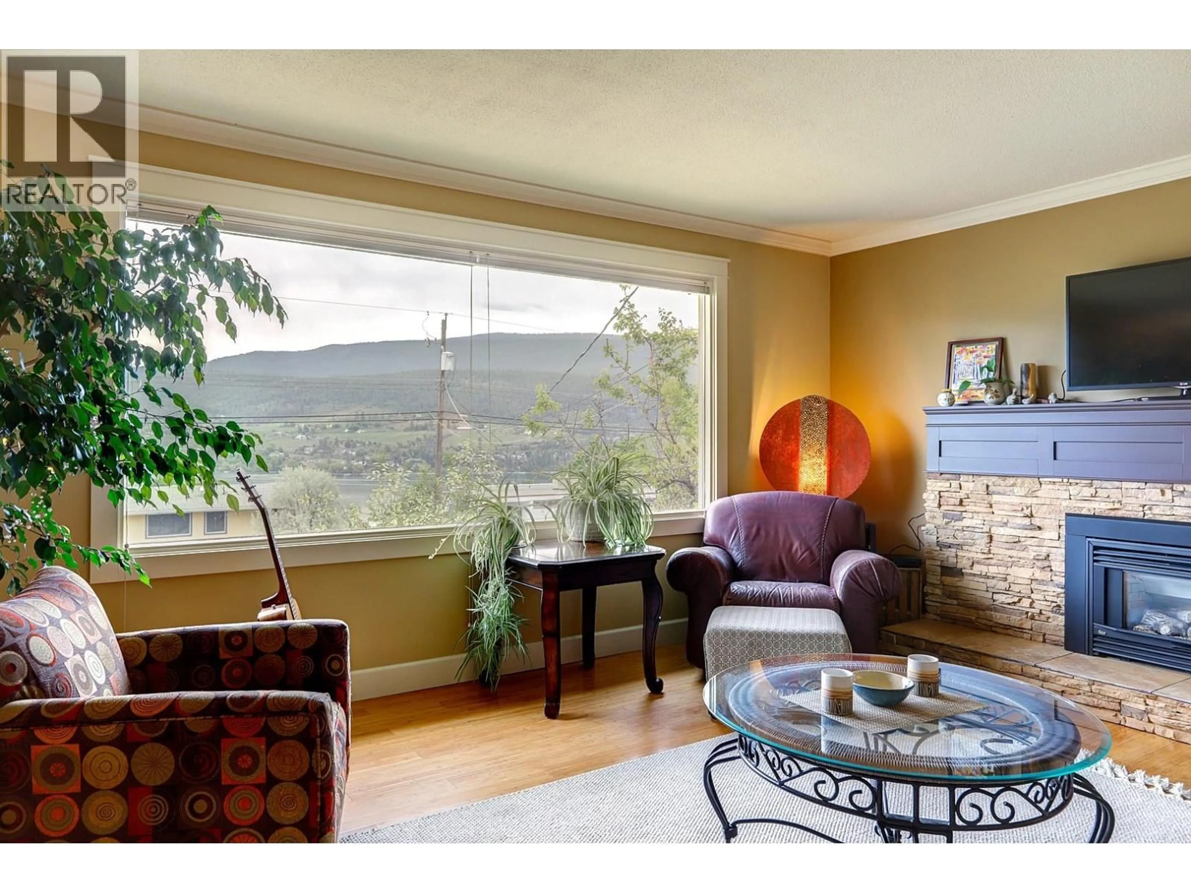 Living room with furniture, unknown for 8308 KALVIEW DRIVE, Coldstream British Columbia V1B1W7