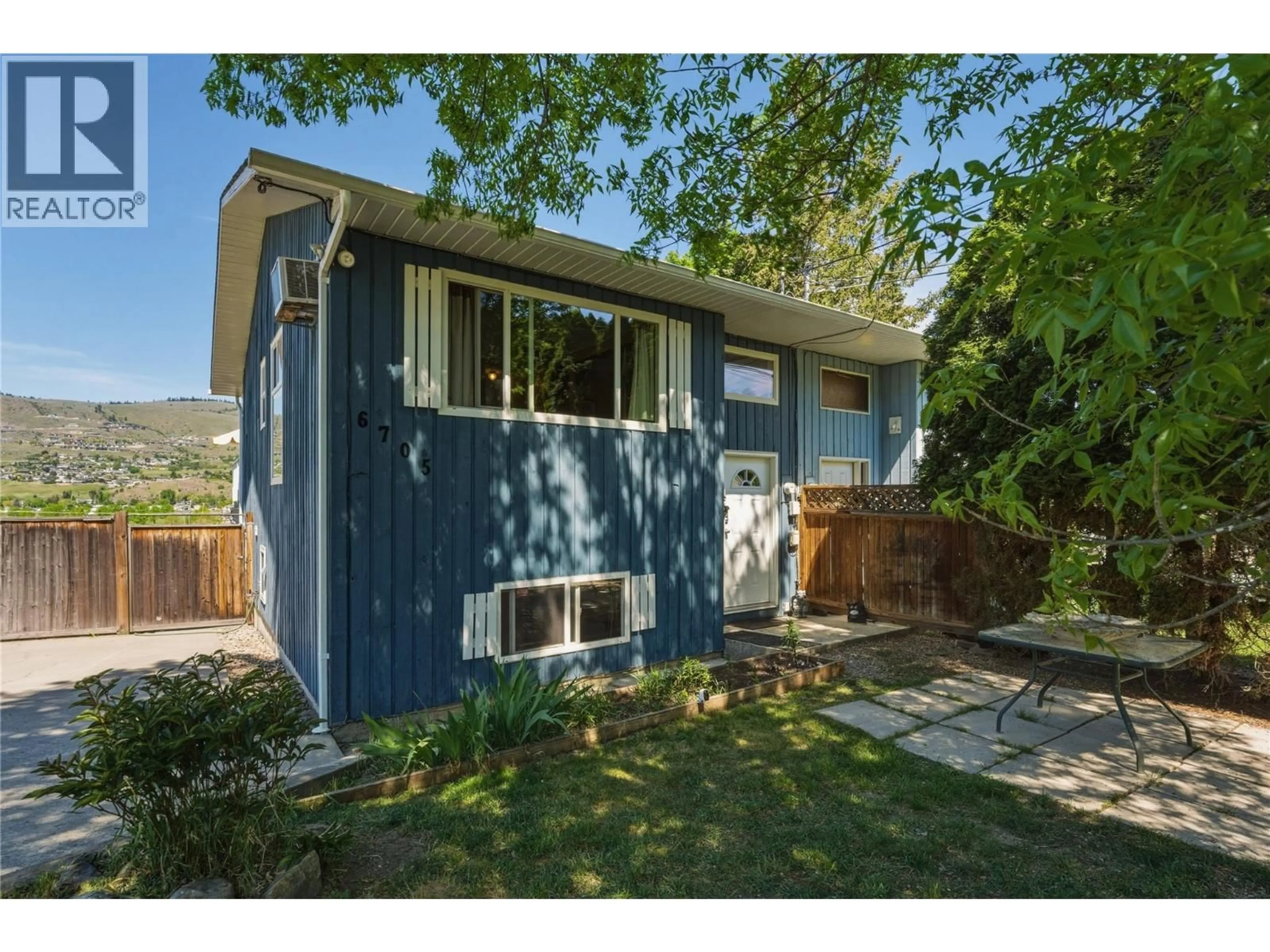 Home with vinyl exterior material, street for 6705 LONGACRE DRIVE, Vernon British Columbia V1H1J1