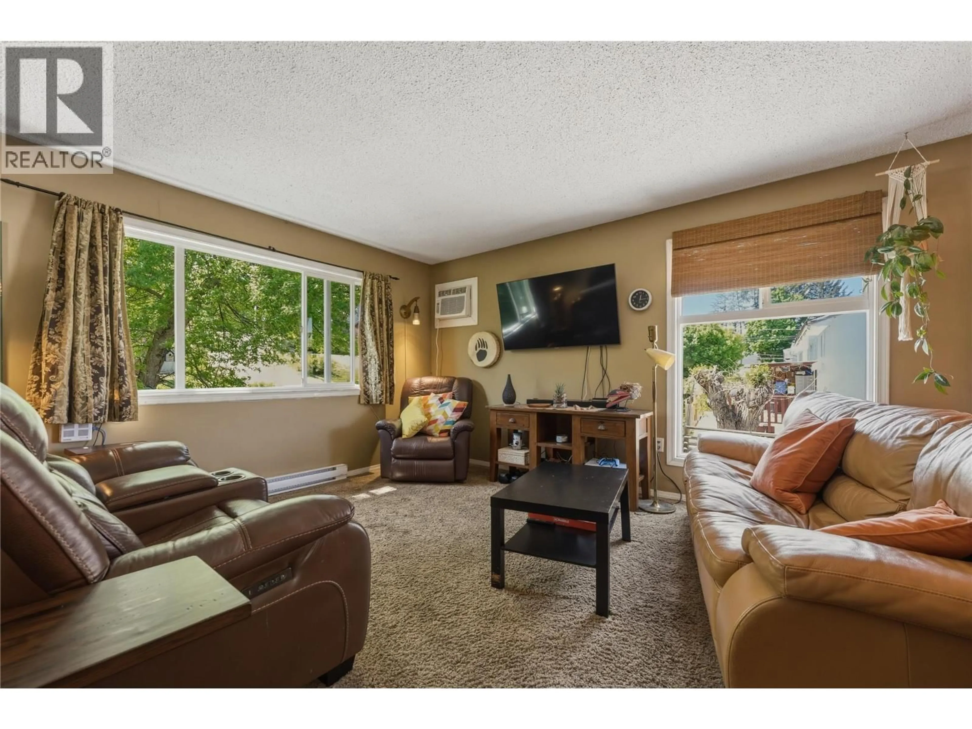Living room with furniture, unknown for 6705 LONGACRE DRIVE, Vernon British Columbia V1H1J1