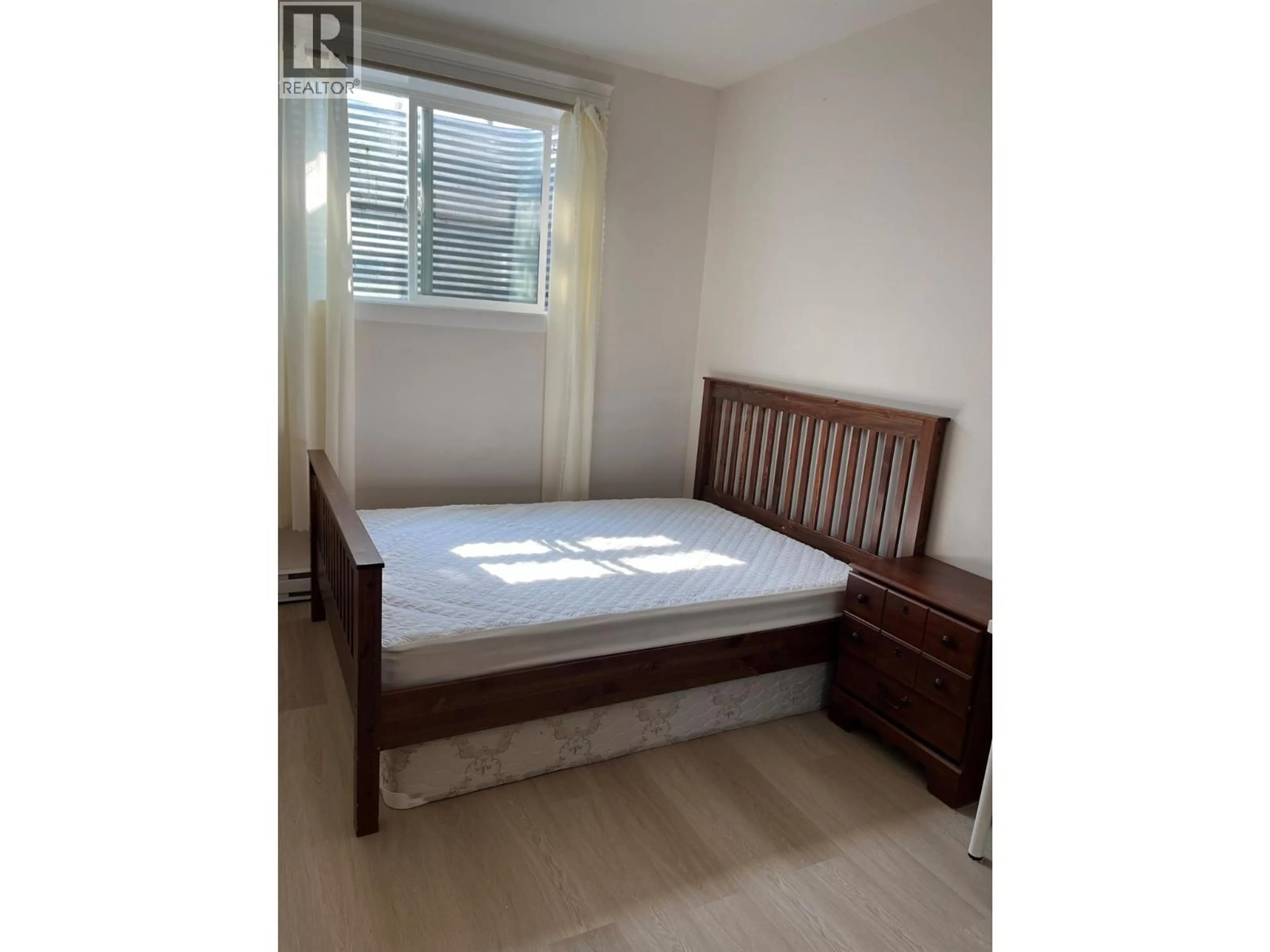 Bedroom with bed, wood/laminate floor for 337 ARAB ROAD, Kelowna British Columbia V1V3A8