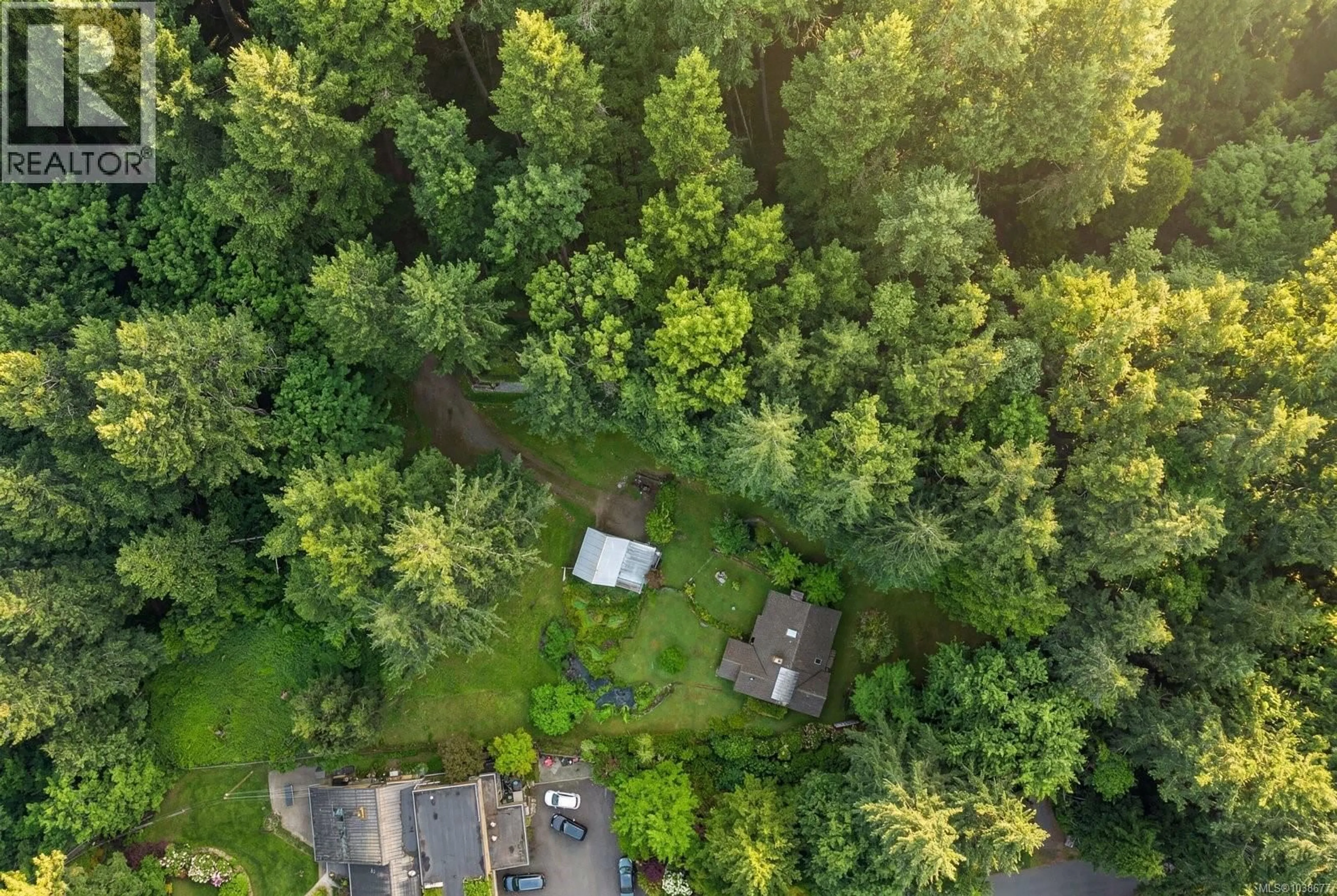 A pic from outside/outdoor area/front of a property/back of a property/a pic from drone, forest/trees view for 1183 HILLGROVE ROAD, North Saanich British Columbia V8L5R8