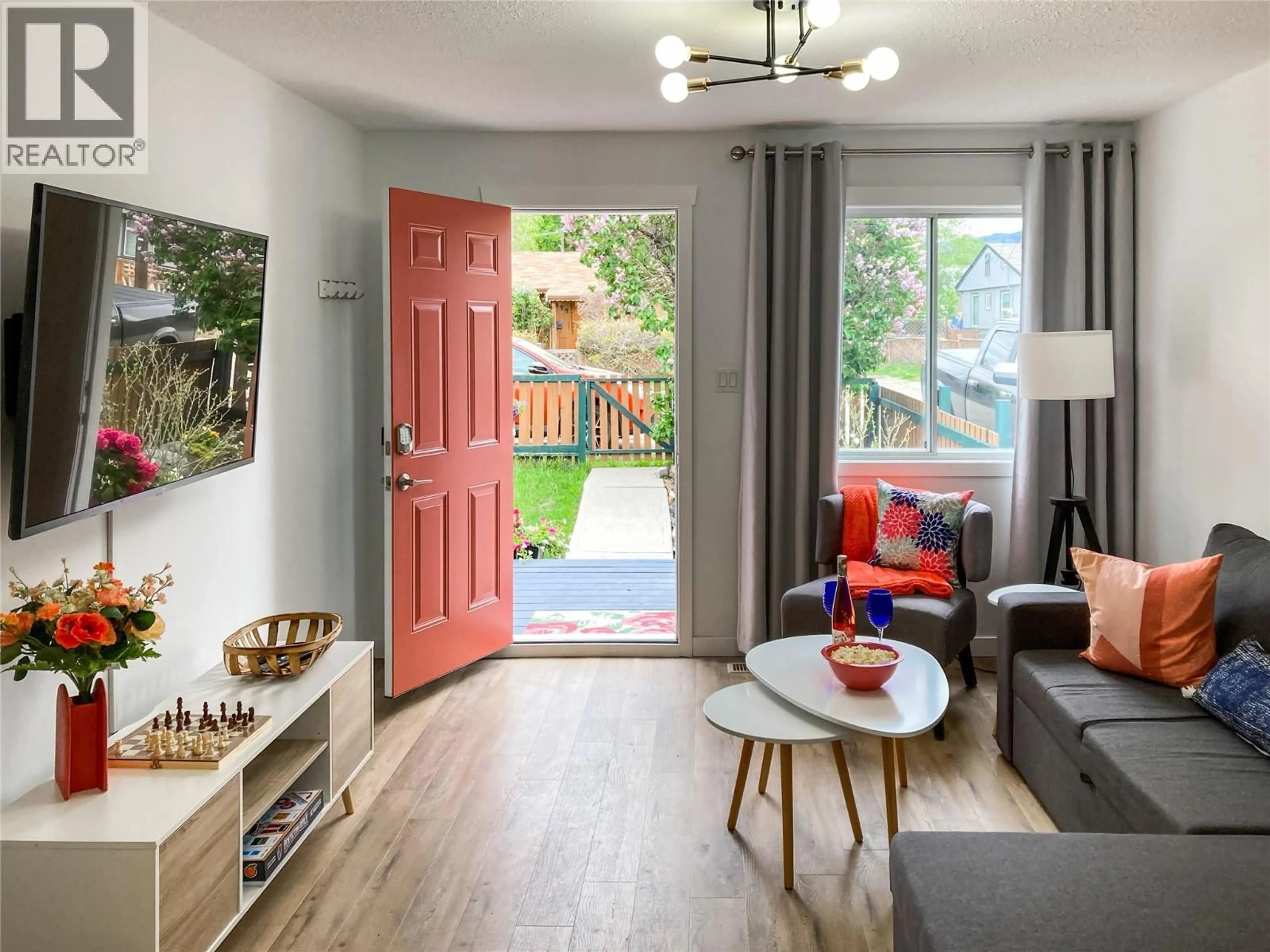 Living room with furniture, wood/laminate floor for 974 CRESTON AVENUE, Penticton British Columbia V2A1P9