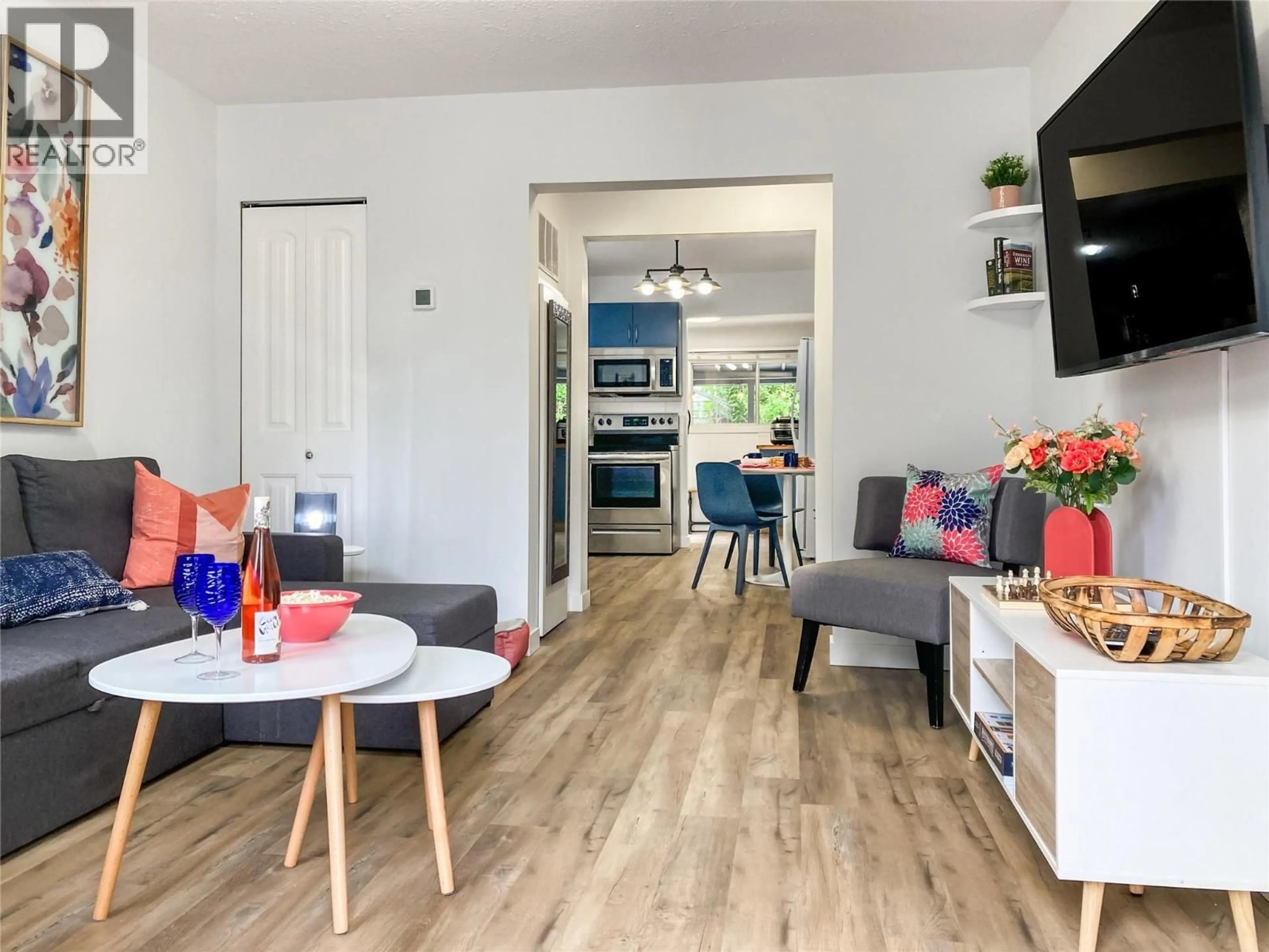 Living room with furniture, wood/laminate floor for 974 CRESTON AVENUE, Penticton British Columbia V2A1P9