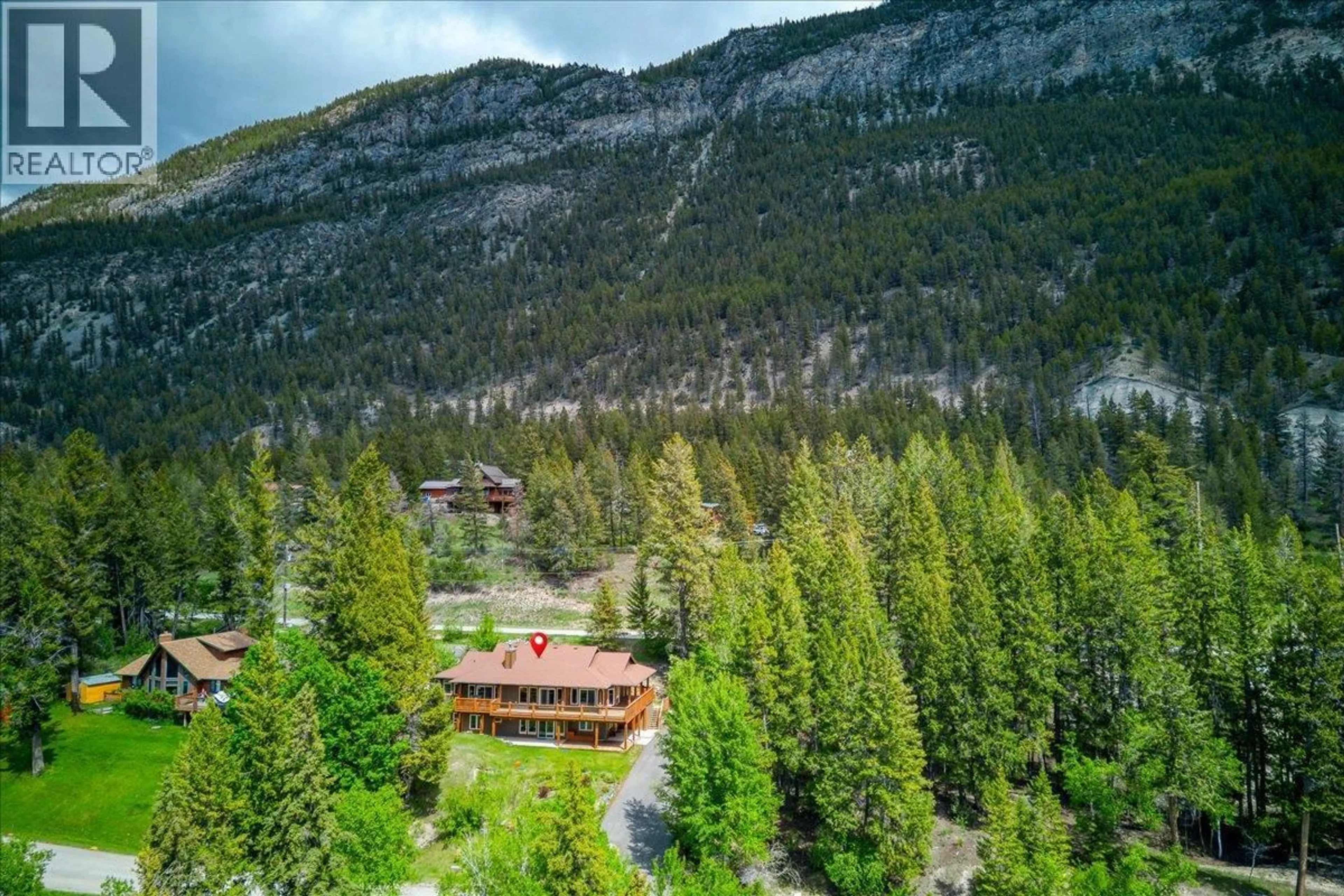 A pic from outside/outdoor area/front of a property/back of a property/a pic from drone, forest/trees view for 8442 RICHARDSON CRESCENT, Canal Flats British Columbia V0B1B0