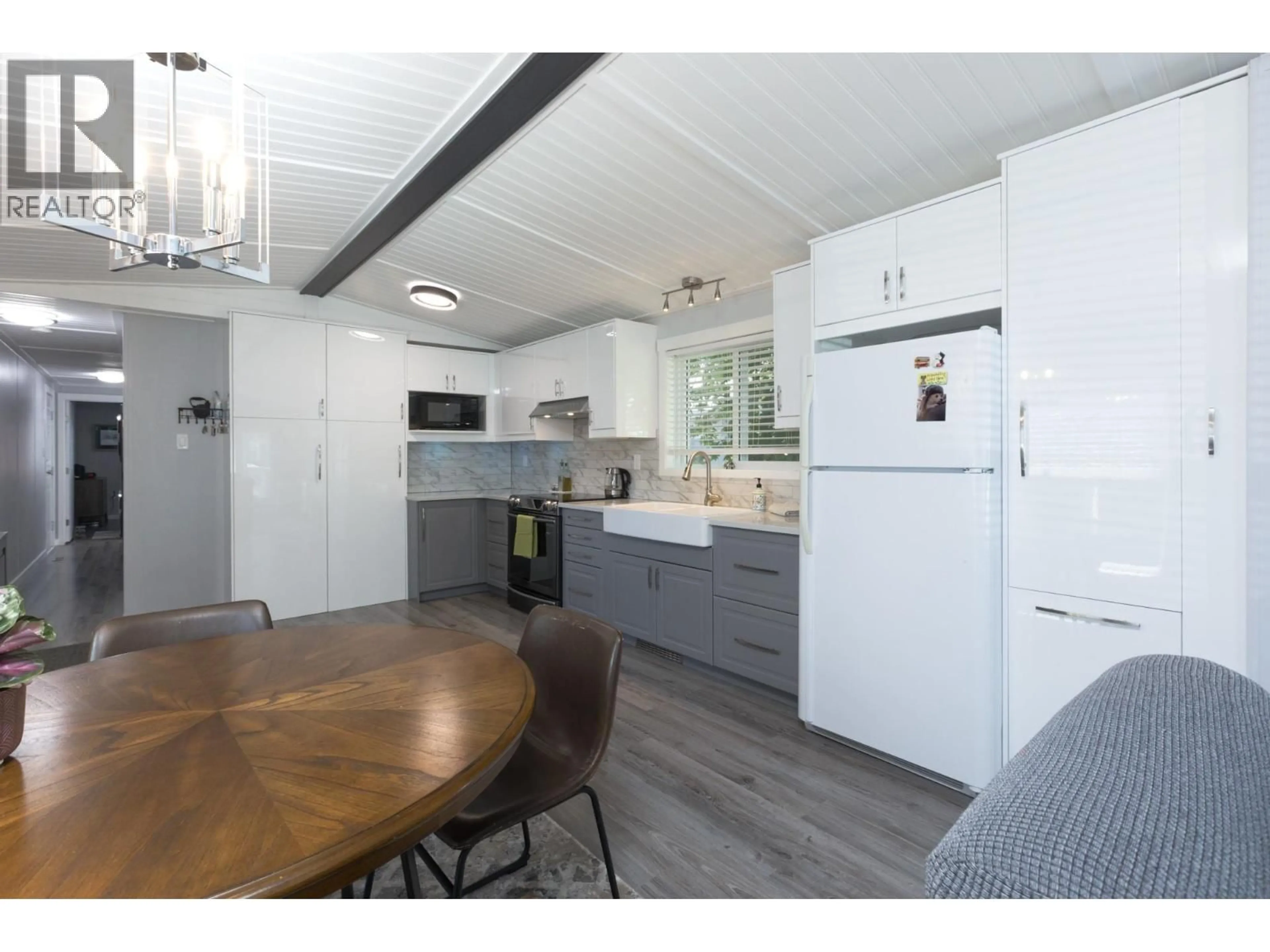Open concept kitchen, wood/laminate floor for 285 - 1999 97 S HIGHWAY, West Kelowna British Columbia V1Z1B2
