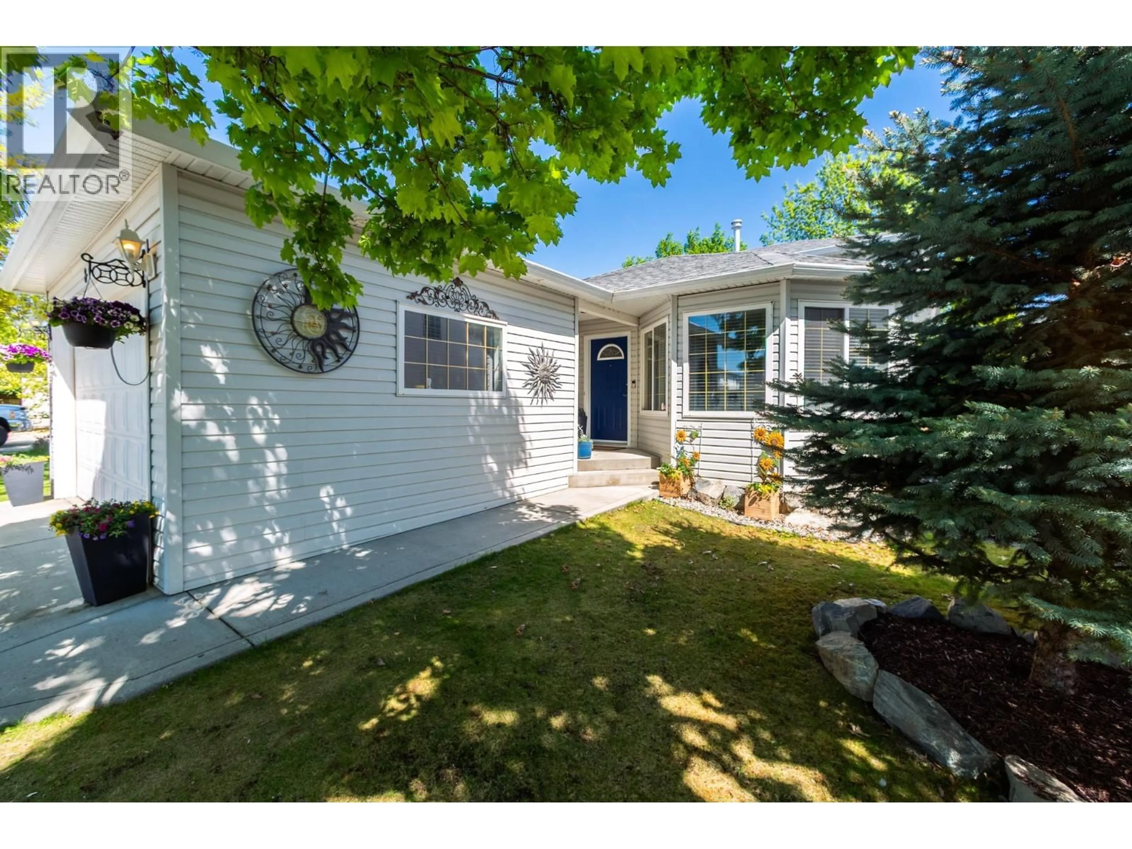 Home with vinyl exterior material, street for 8 - 4450 POSTILL DRIVE, Kelowna British Columbia V1X7T9