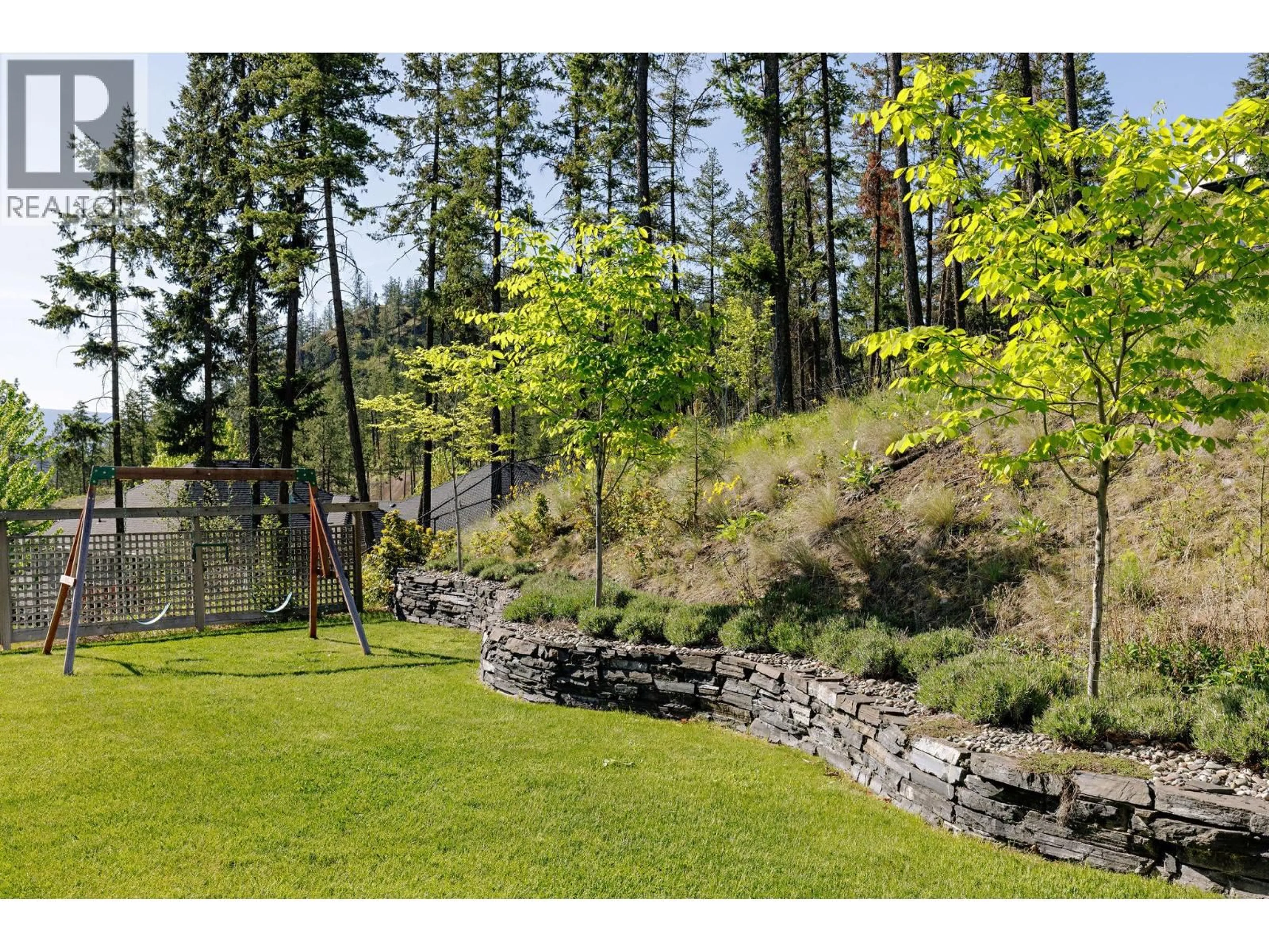 A pic from outside/outdoor area/front of a property/back of a property/a pic from drone, forest/trees view for 206 WILDEN RIDGE DRIVE, Kelowna British Columbia V1V2Z9