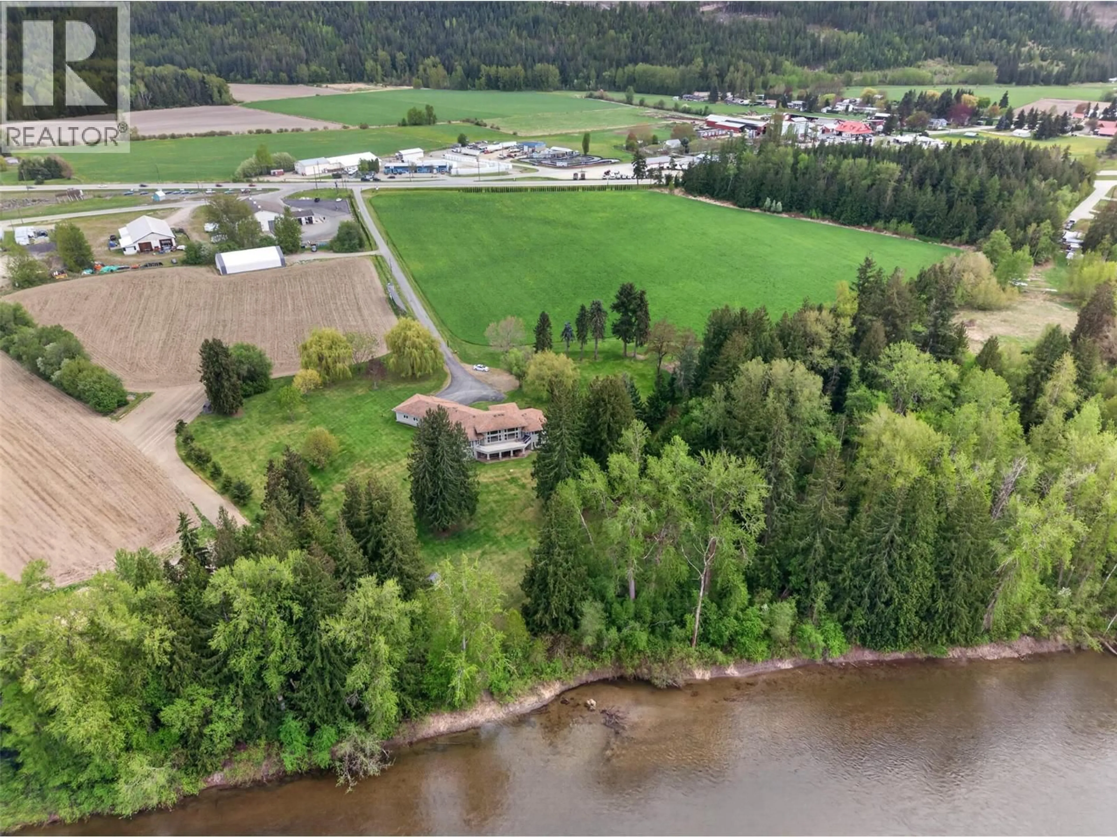 A pic from outside/outdoor area/front of a property/back of a property/a pic from drone, water/lake/river/ocean view for 1200 TRANS CANADA HIGHWAY, Sicamous British Columbia V0E2V0