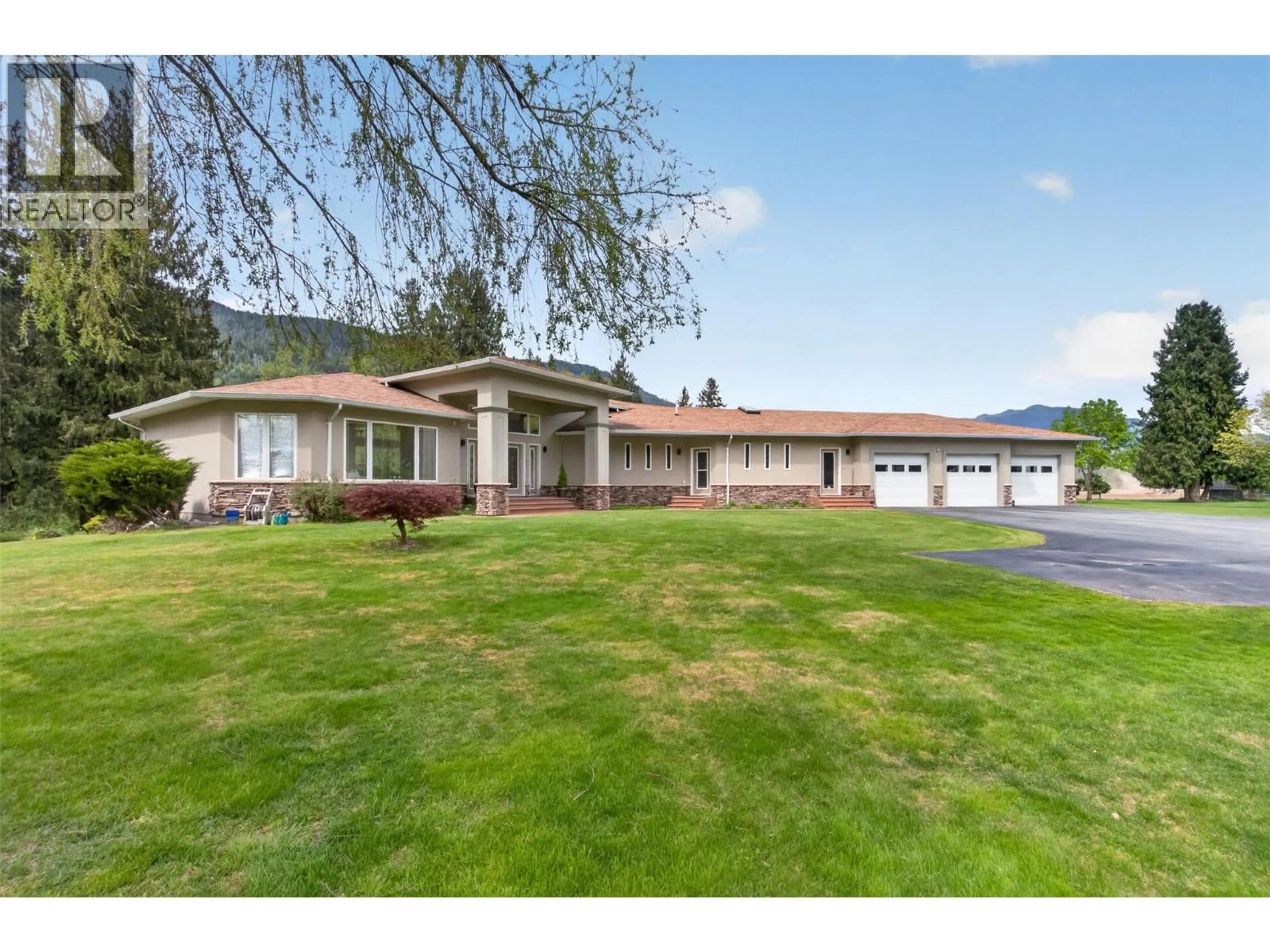 A pic from outside/outdoor area/front of a property/back of a property/a pic from drone, water/lake/river/ocean view for 1200 TRANS CANADA HIGHWAY, Sicamous British Columbia V0E2V0