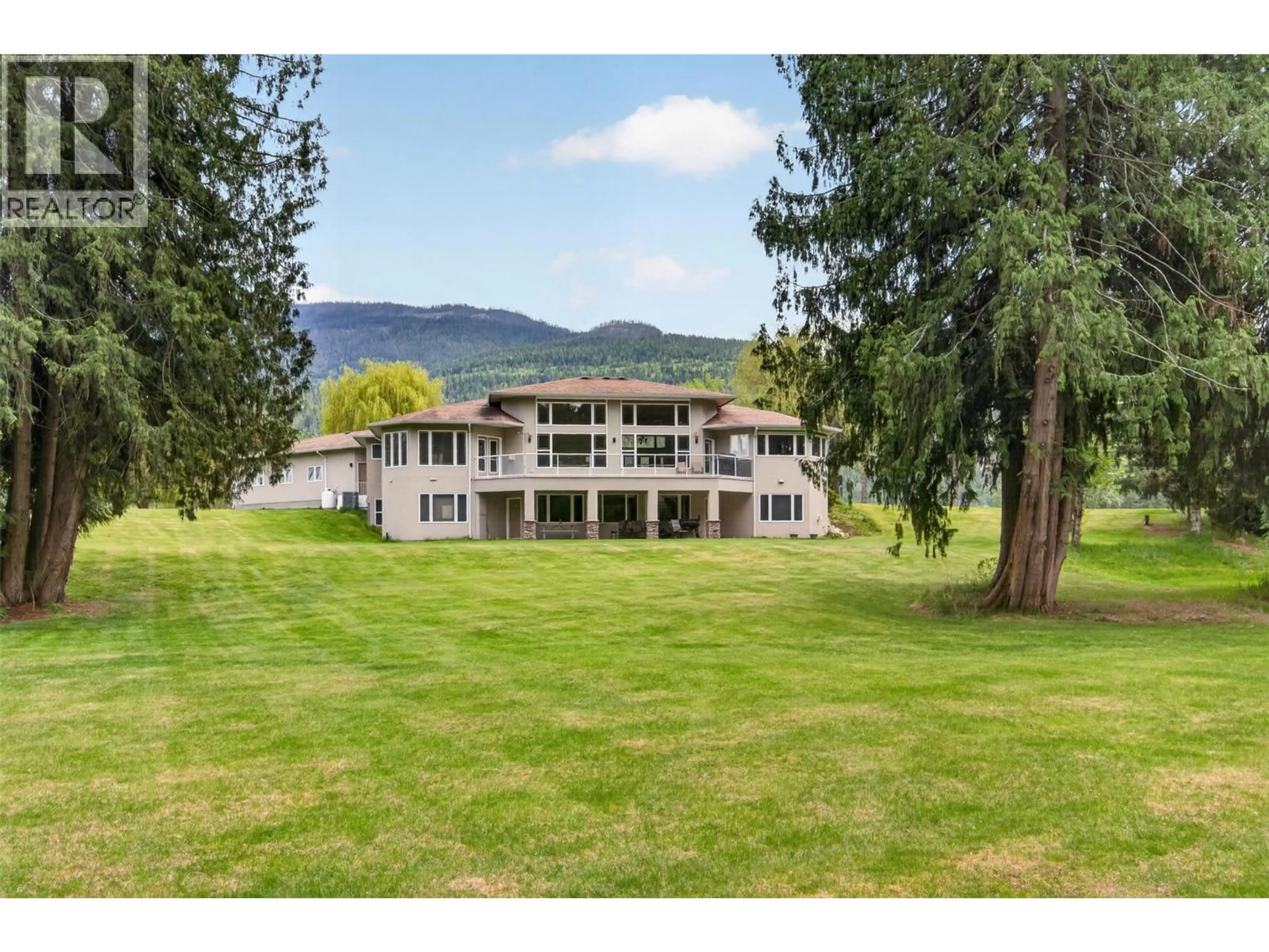 A pic from outside/outdoor area/front of a property/back of a property/a pic from drone, mountain view for 1200 TRANS CANADA HIGHWAY, Sicamous British Columbia V0E2V0
