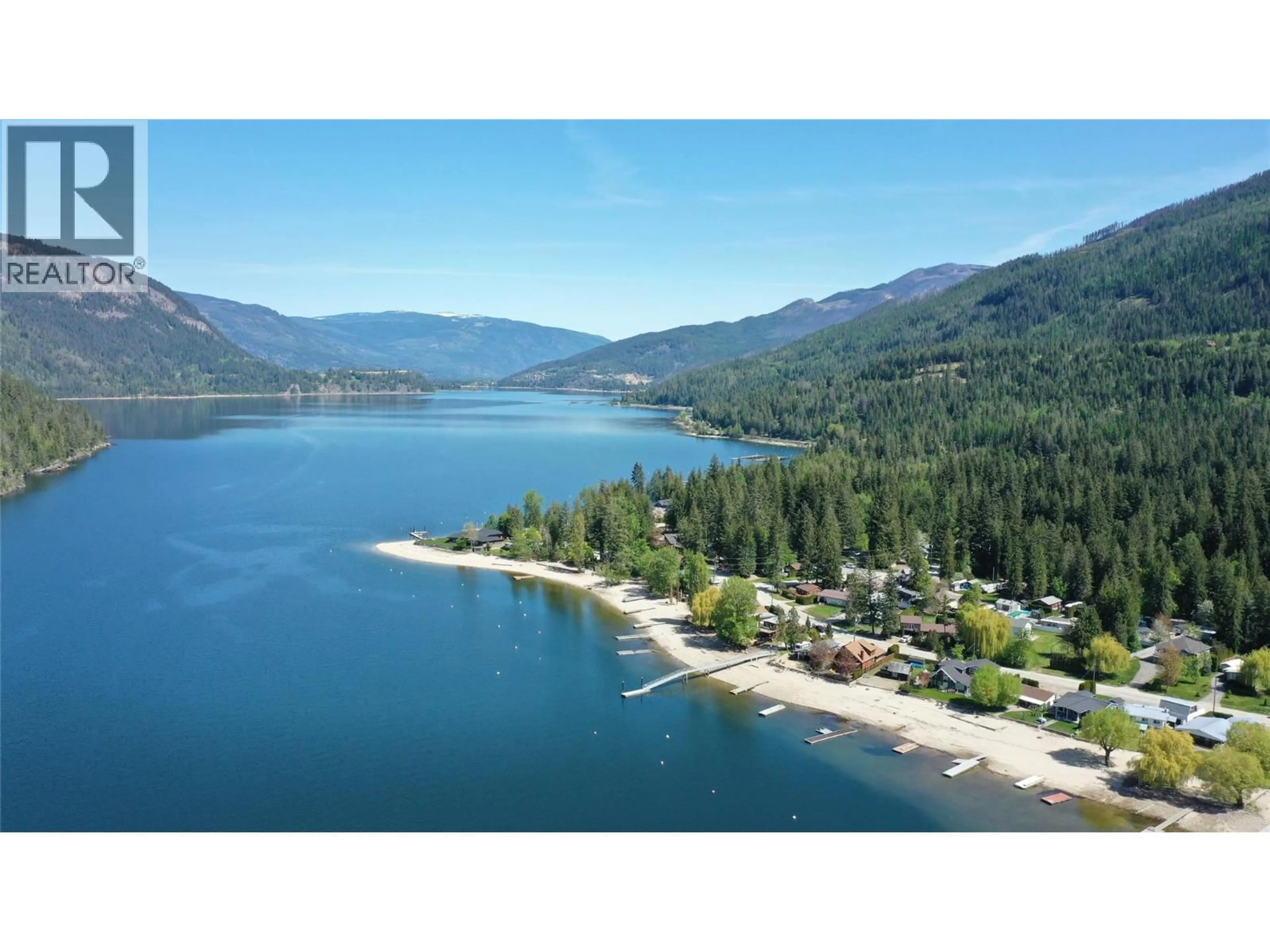 A pic from outside/outdoor area/front of a property/back of a property/a pic from drone, water/lake/river/ocean view for 8979 HUMMINGBIRD FRONTAGE ROAD, Swansea Point British Columbia V0E2K2