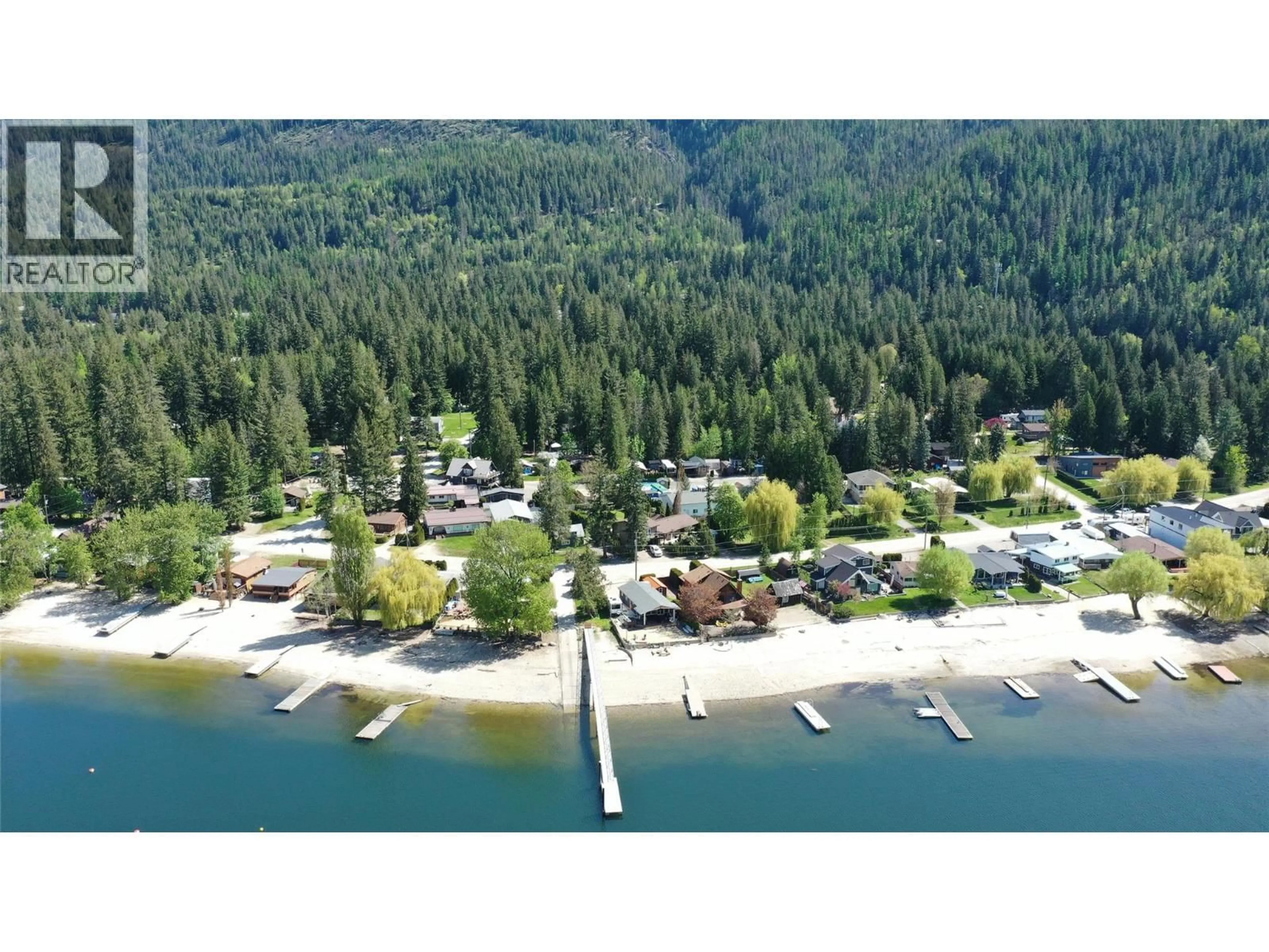 A pic from outside/outdoor area/front of a property/back of a property/a pic from drone, water/lake/river/ocean view for 8979 HUMMINGBIRD FRONTAGE ROAD, Swansea Point British Columbia V0E2K2