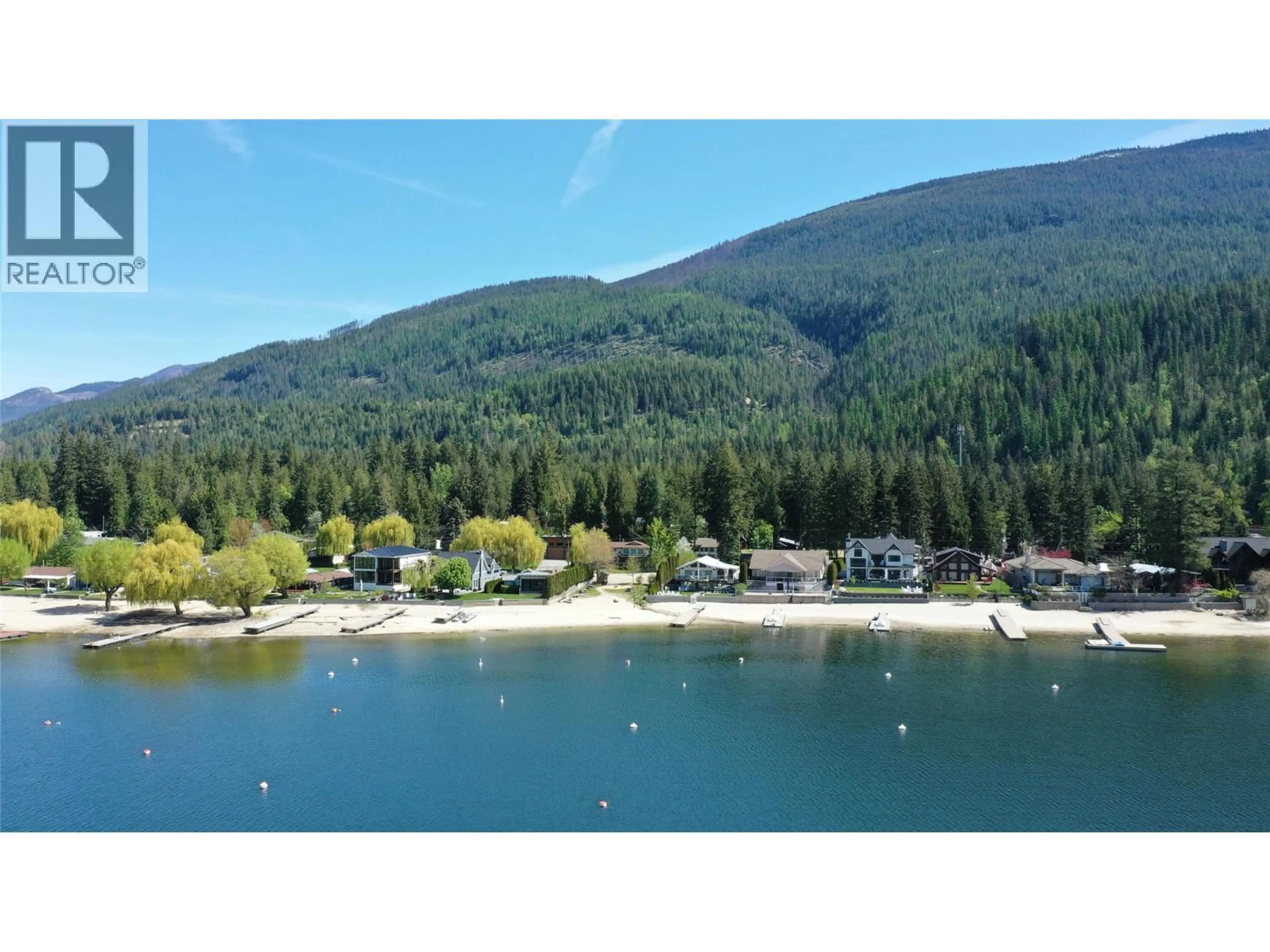 A pic from outside/outdoor area/front of a property/back of a property/a pic from drone, water/lake/river/ocean view for 8979 HUMMINGBIRD FRONTAGE ROAD, Swansea Point British Columbia V0E2K2