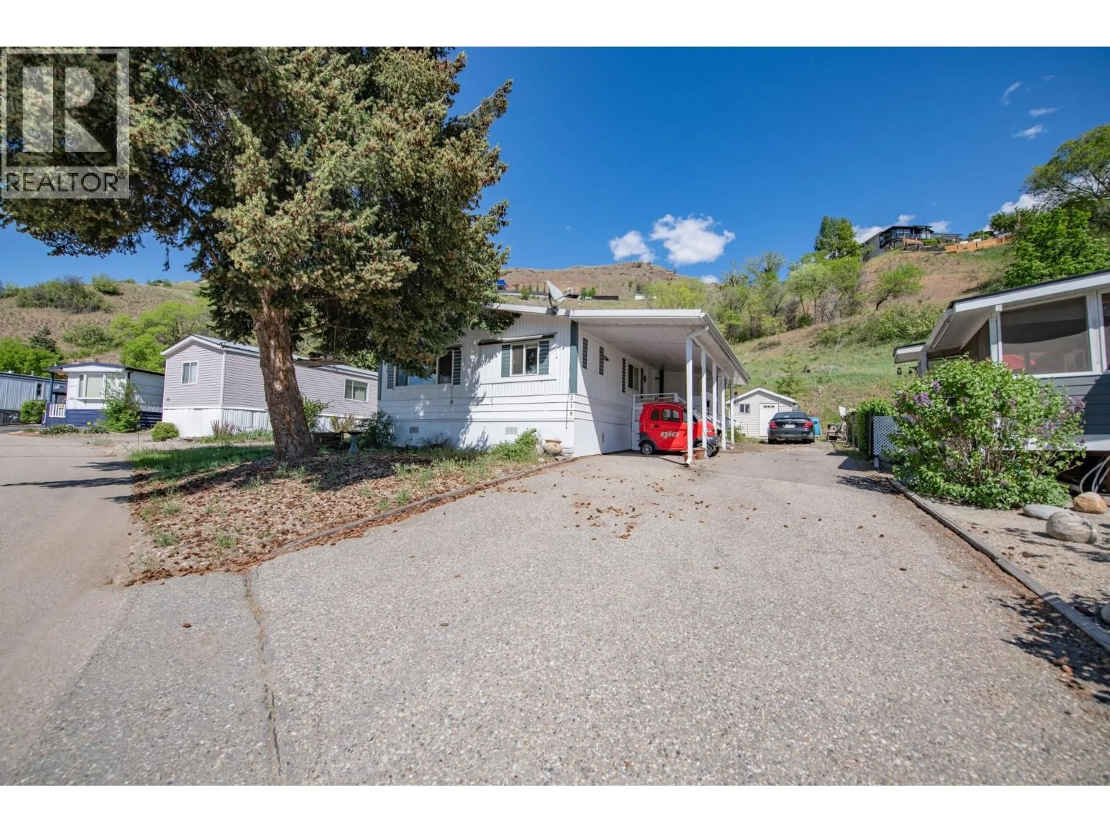 A pic from outside/outdoor area/front of a property/back of a property/a pic from drone, street for 15401 KALAMALKA ROAD, Coldstream British Columbia V1B1Z3