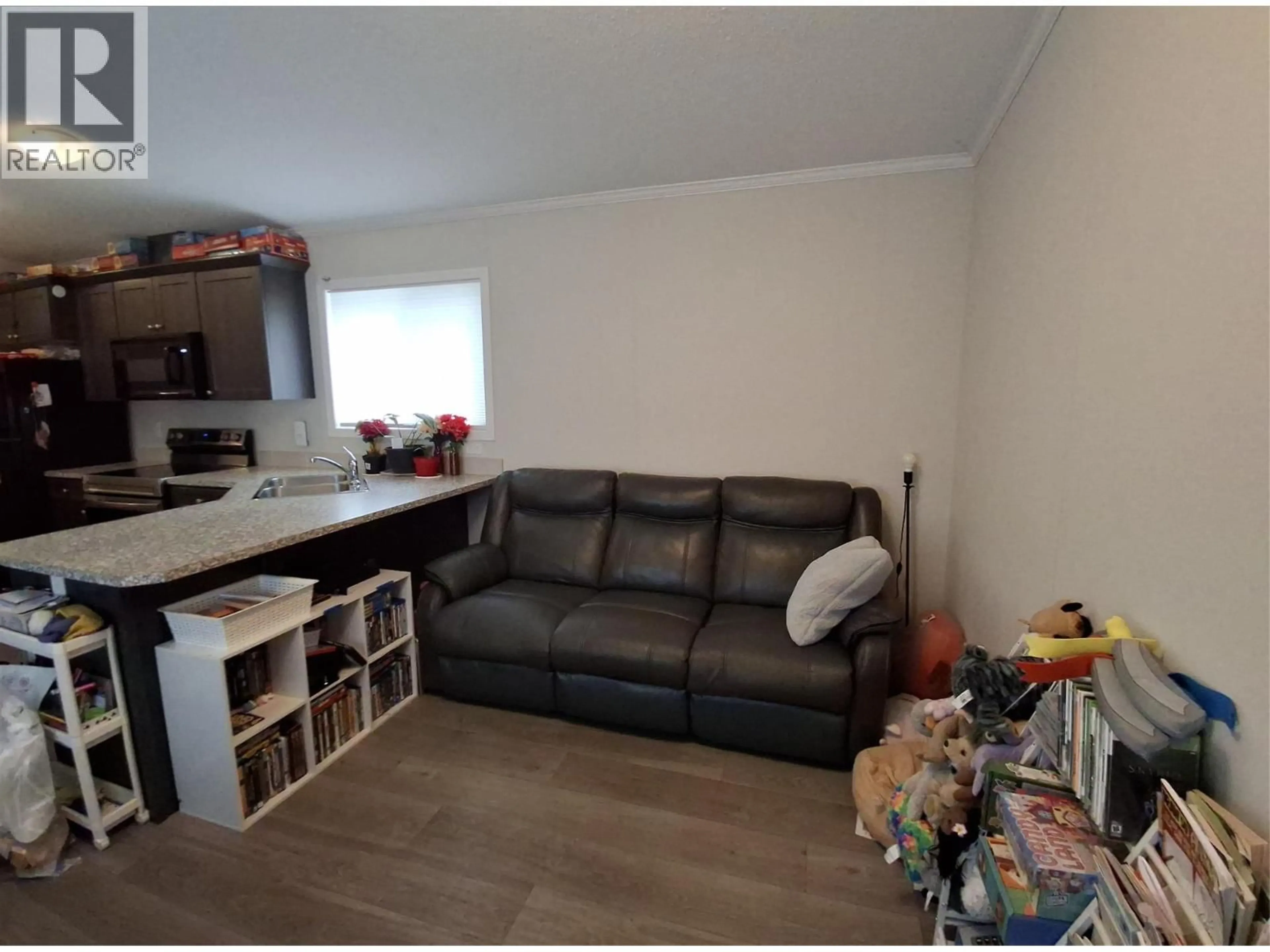 Living room with furniture, wood/laminate floor for 10 - 235 AYLMER ROAD, Chase British Columbia V0E1M1