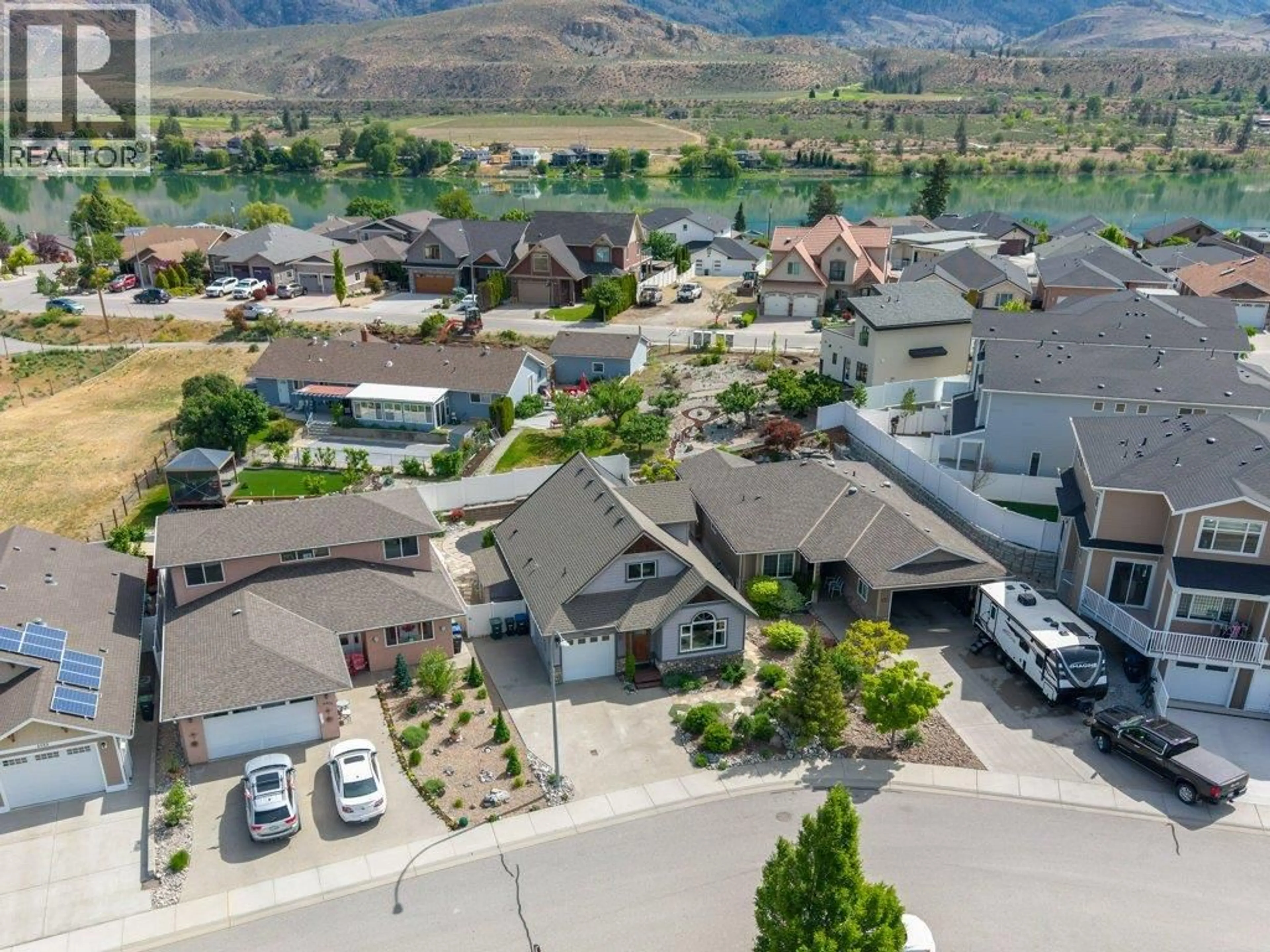 A pic from outside/outdoor area/front of a property/back of a property/a pic from drone, mountain view for 6925 CHARDONNAY PLACE, Oliver British Columbia V0H1T4