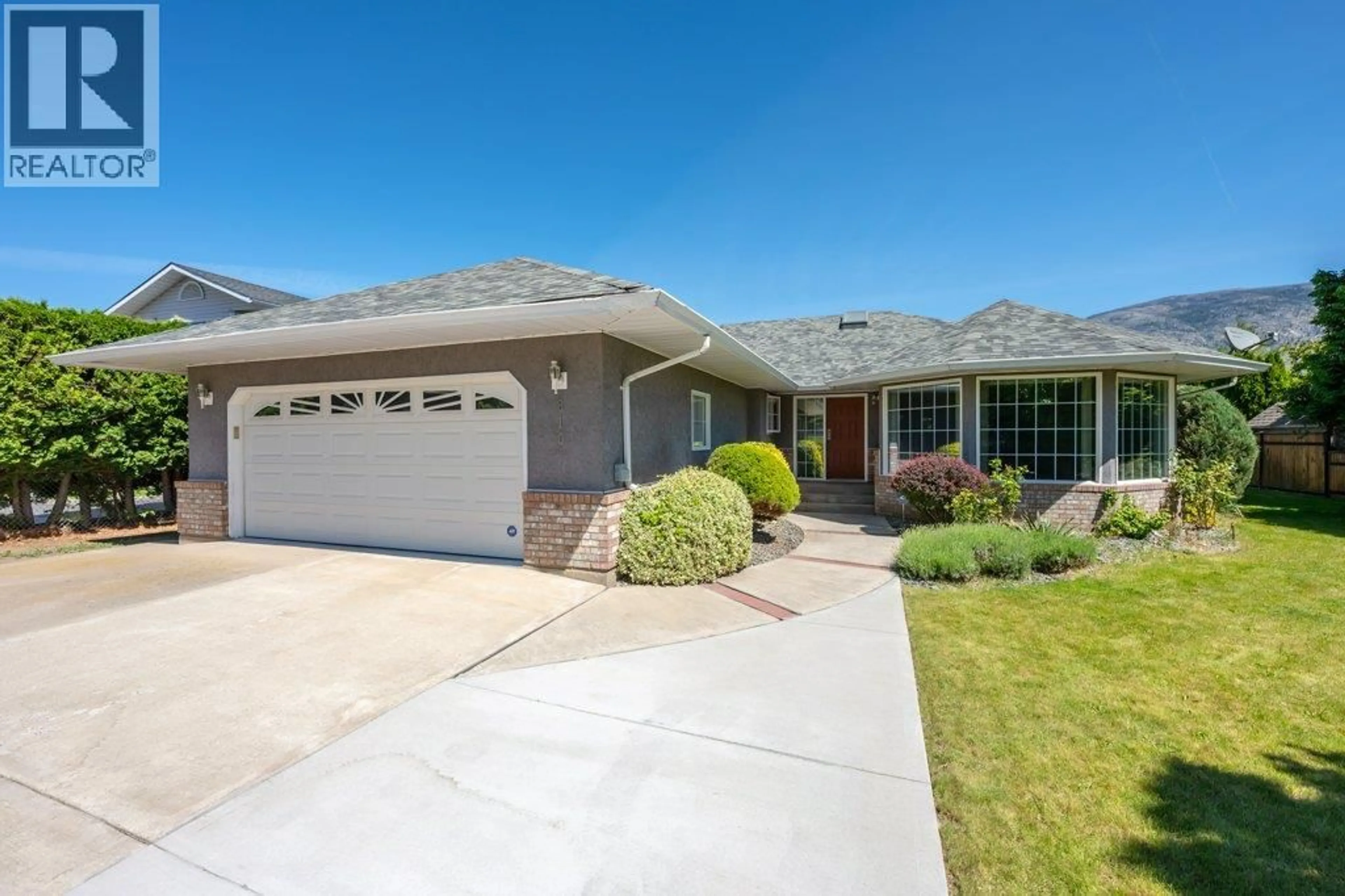Home with vinyl exterior material, street for 810 MERLOT AVENUE, Oliver British Columbia V0H1T4