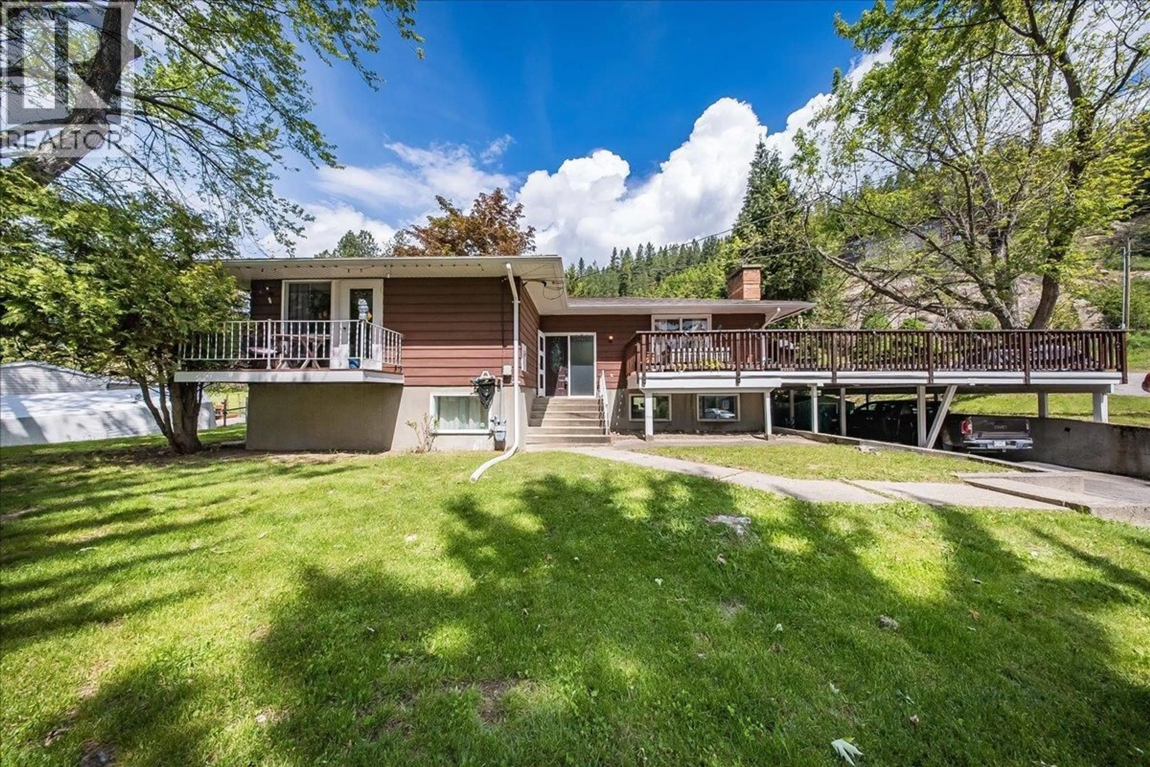 A pic from outside/outdoor area/front of a property/back of a property/a pic from drone, mountain view for 1106 CLARKE ROAD, Robson British Columbia V0G1X0