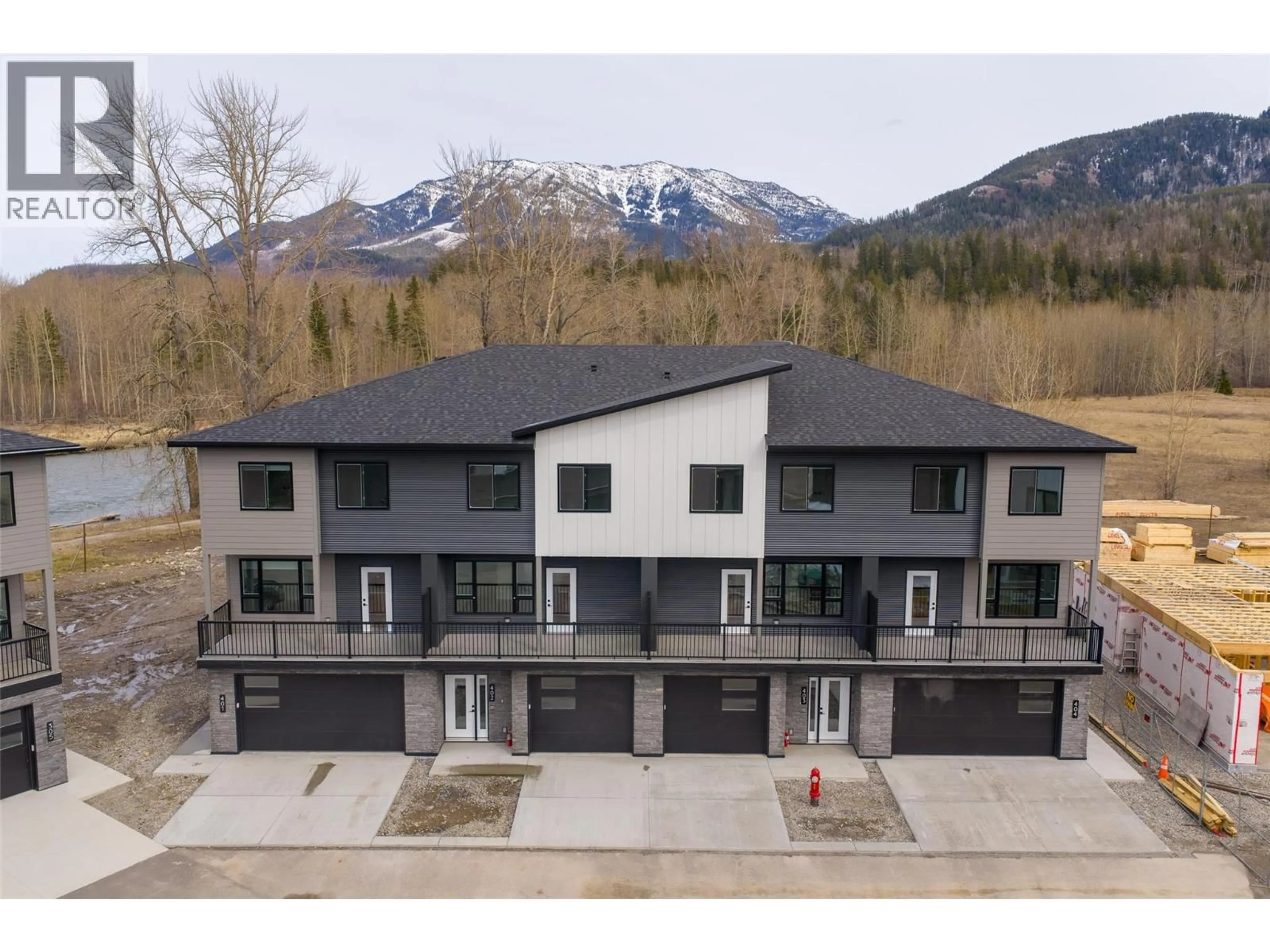 A pic from outside/outdoor area/front of a property/back of a property/a pic from drone, mountain view for 403 - 800 RIVERSIDE WAY, Fernie British Columbia V0B1M7