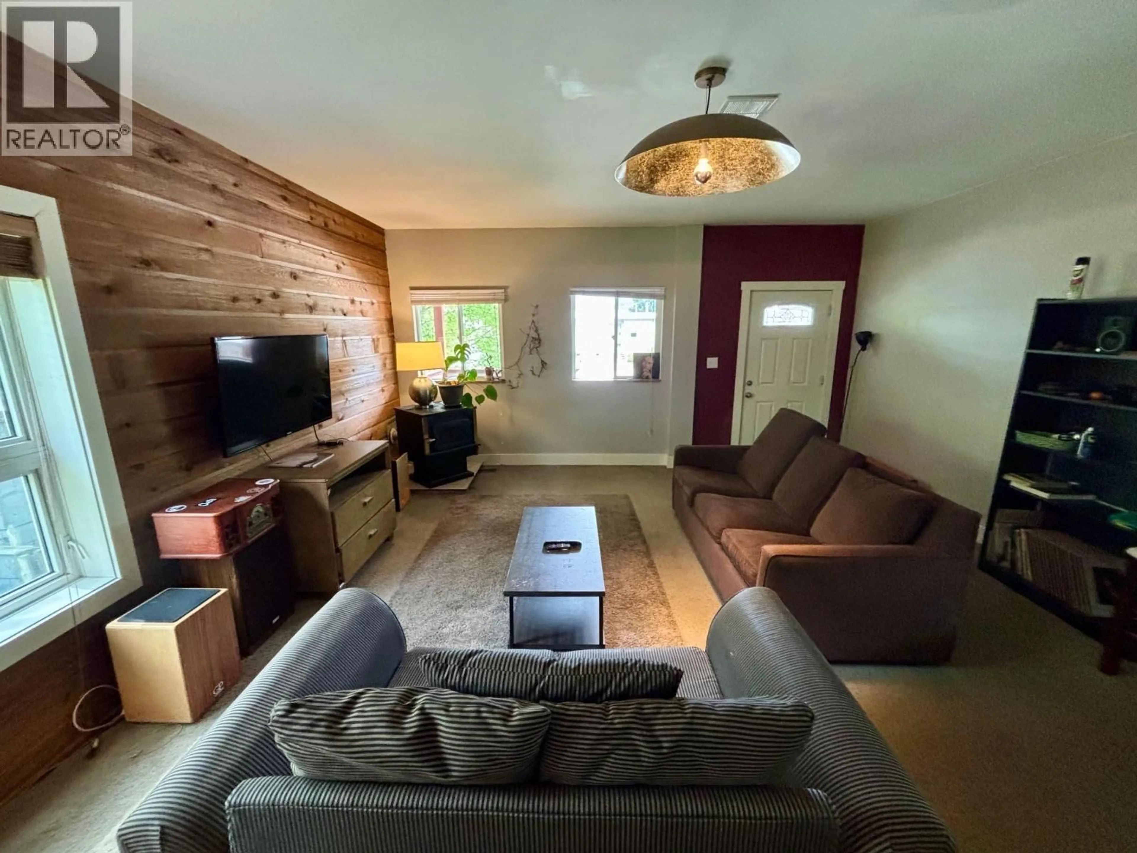 Living room with furniture, wood/laminate floor for 408 THIRD STREET WEST, Revelstoke British Columbia V0E2S0