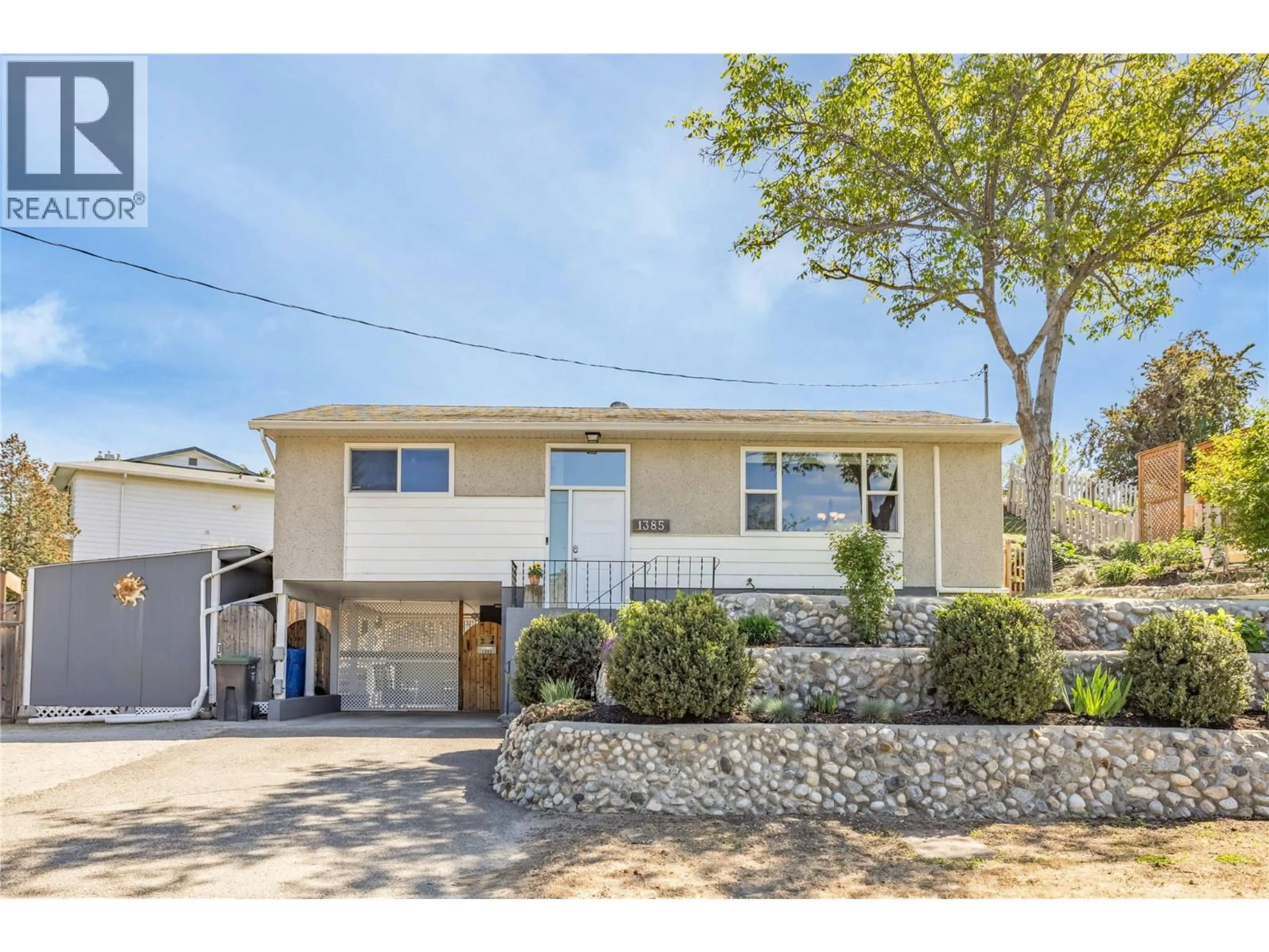 Home with vinyl exterior material, street for 1385 ORCHARD DRIVE, Kelowna British Columbia V1Y3V1
