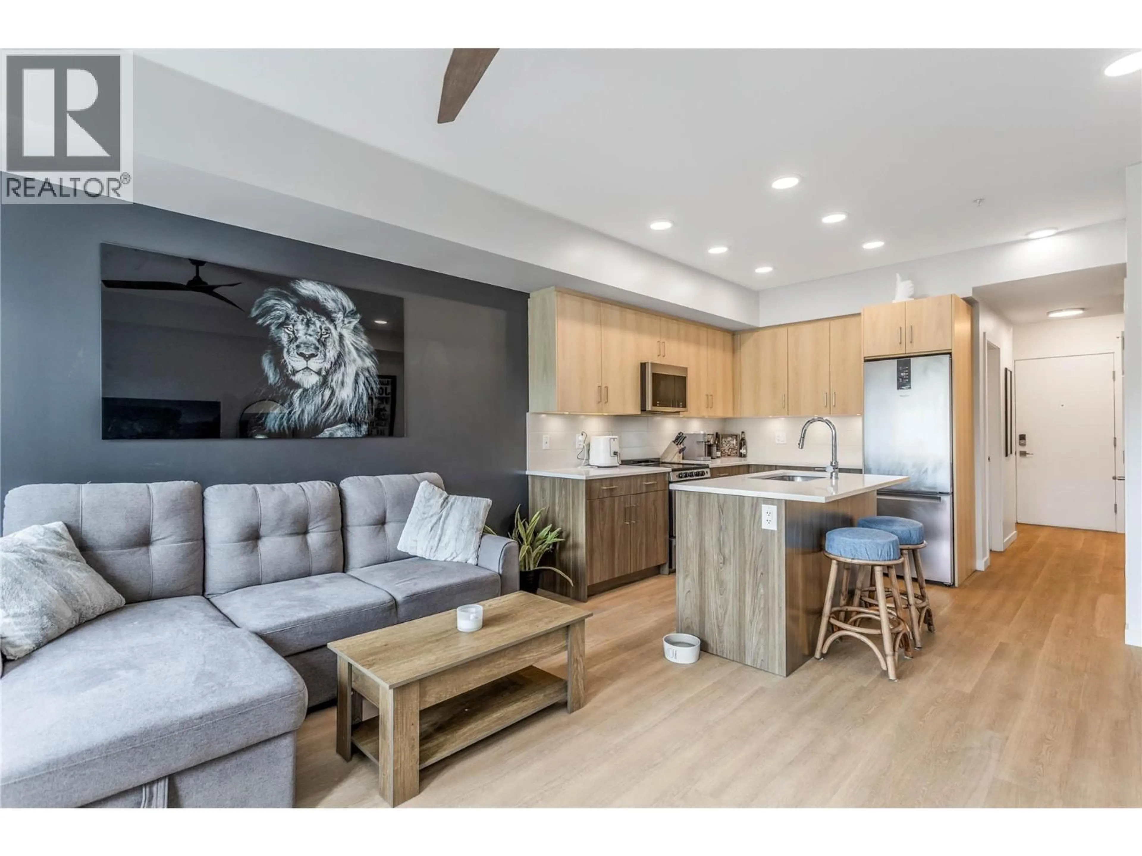 Open concept kitchen, wood/laminate floor for 104 - 2301 CARRINGTON ROAD, West Kelowna British Columbia V4T0E2