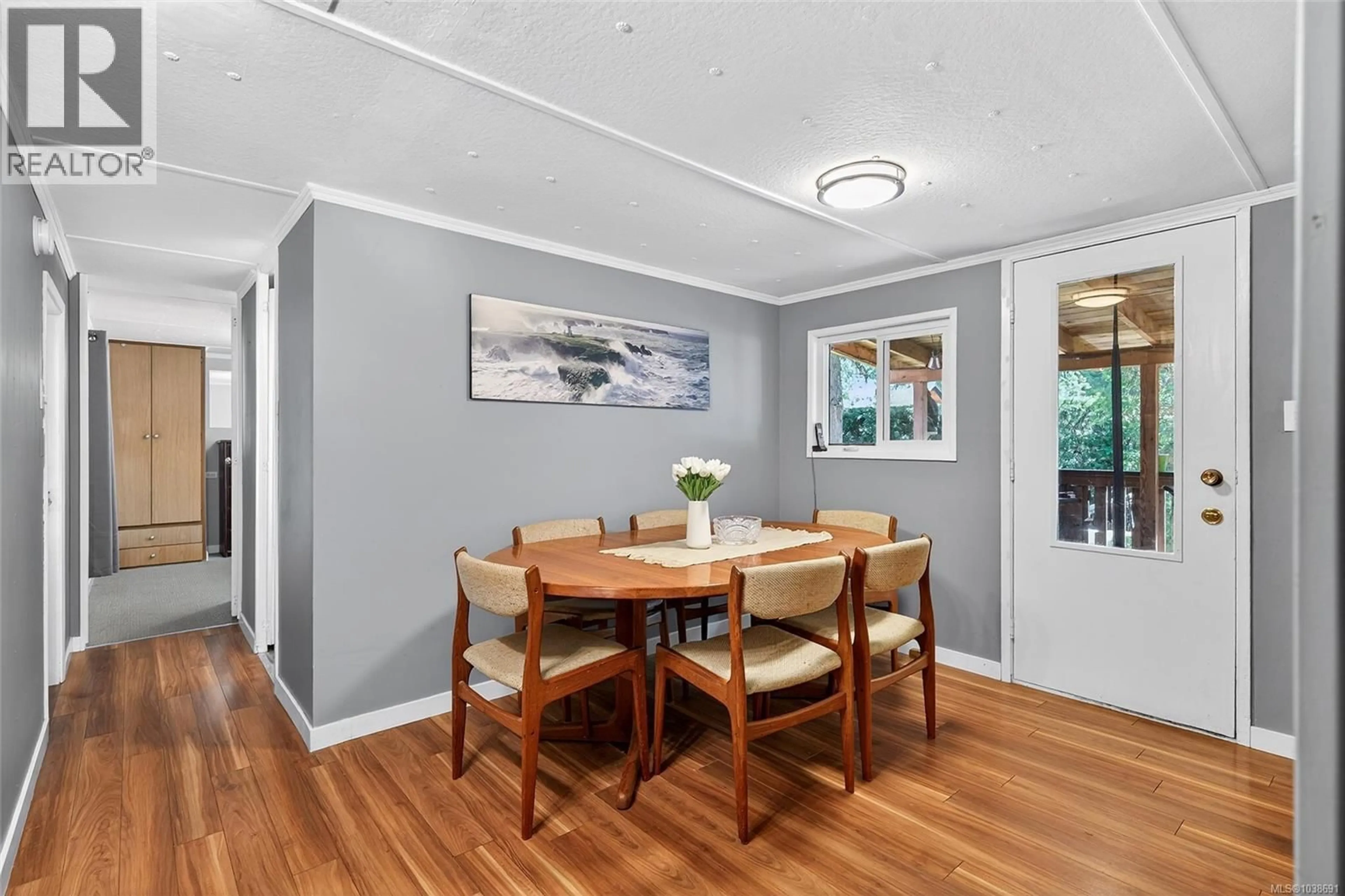 Dining room, wood/laminate floor for 695 BARCLAY CRESCENT NORTH, Parksville British Columbia V9P1X9