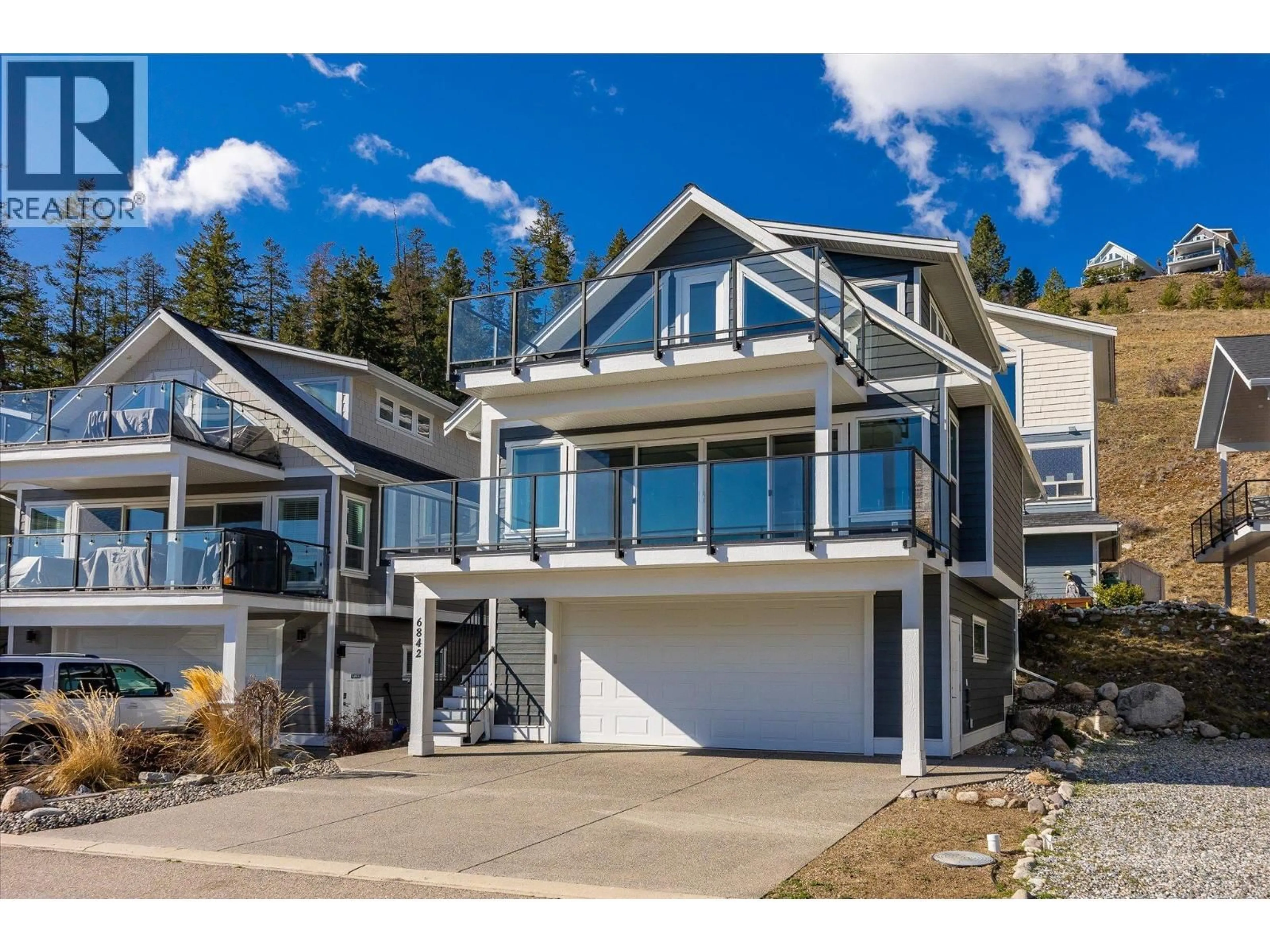 Home with vinyl exterior material, unknown for 6842 MADRID WAY, Kelowna British Columbia V1Z3R8
