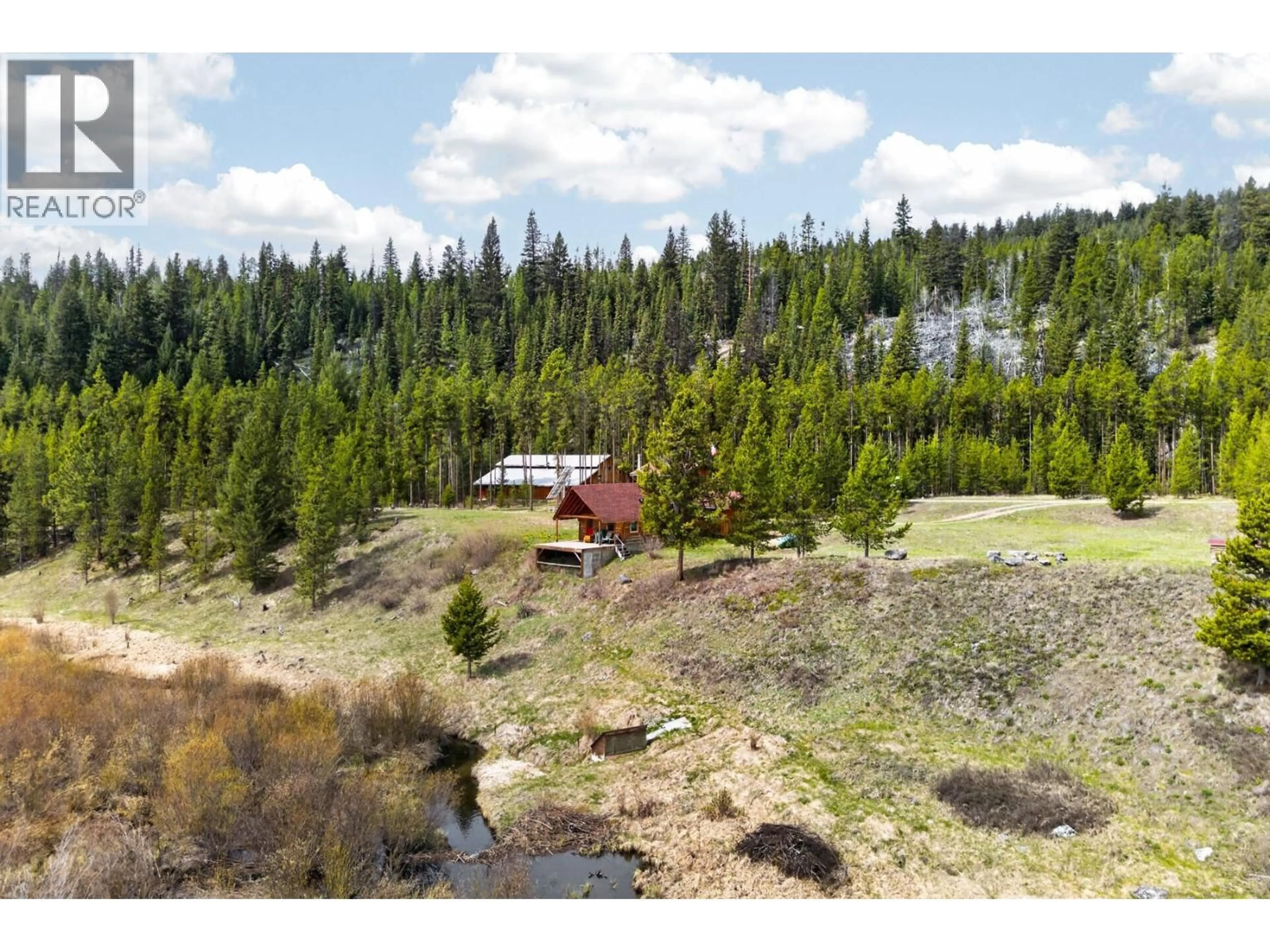 A pic from outside/outdoor area/front of a property/back of a property/a pic from drone, forest/trees view for 5000 STARSHINE WAY, Merritt British Columbia V1K1B8