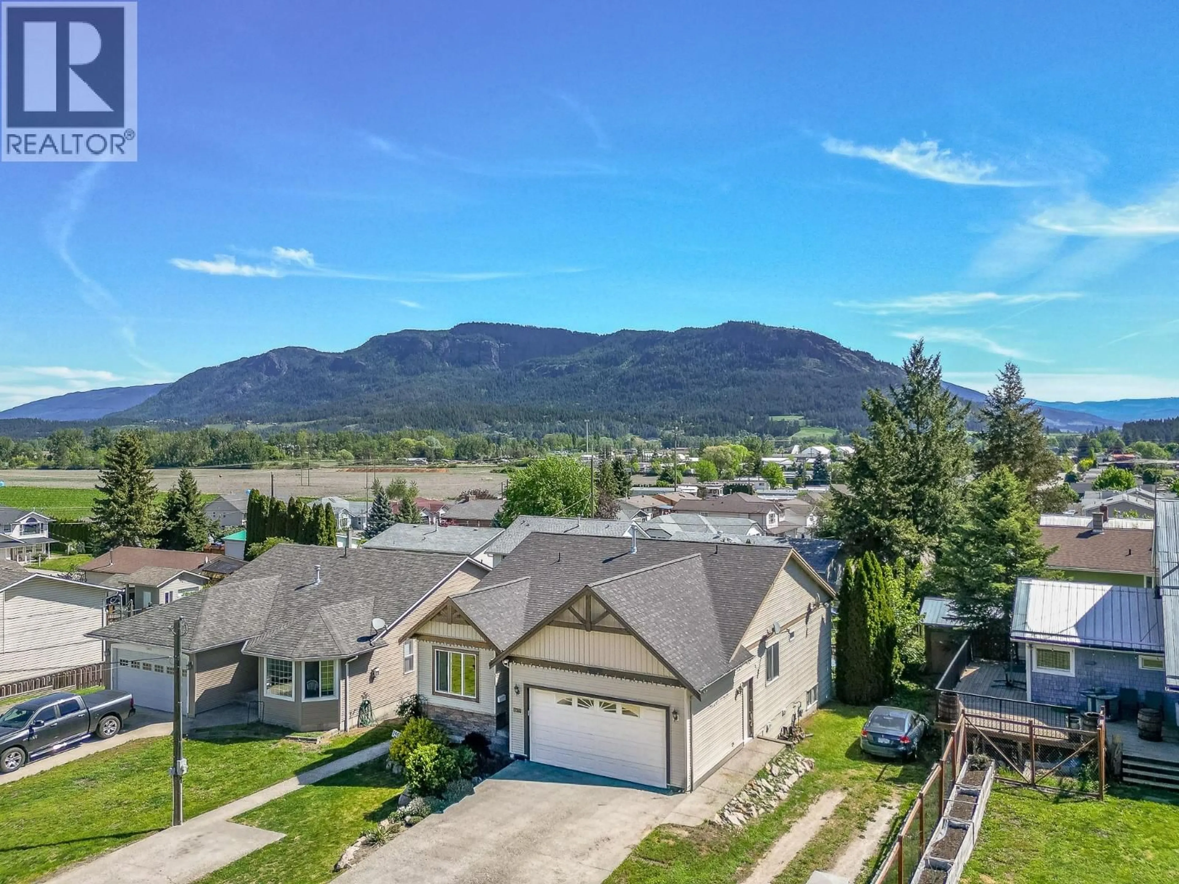 A pic from outside/outdoor area/front of a property/back of a property/a pic from drone, mountain view for 1903 NORTHERN STREET, Enderby British Columbia V0E1V0