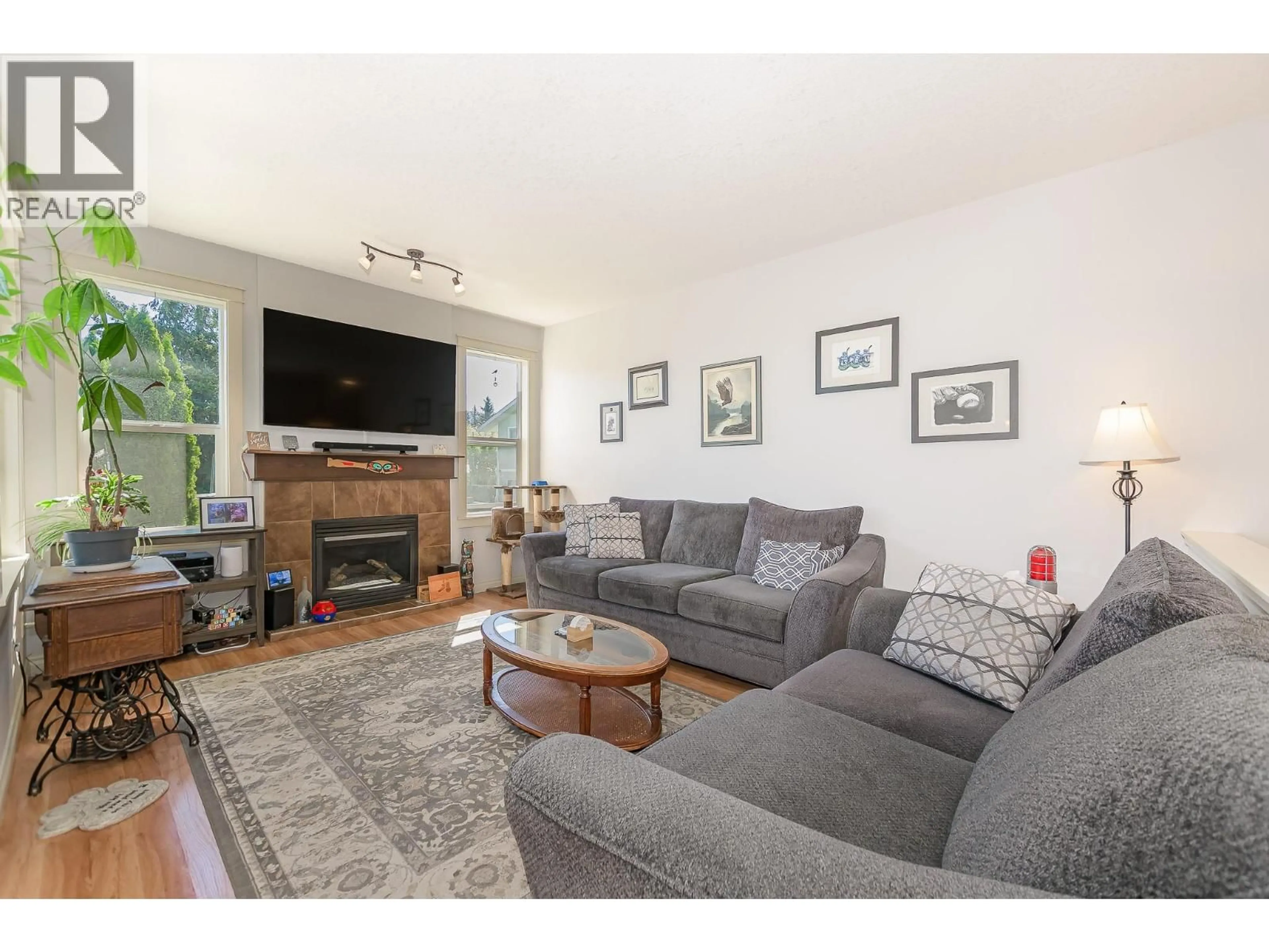 Living room with furniture, wood/laminate floor for 1903 NORTHERN STREET, Enderby British Columbia V0E1V0