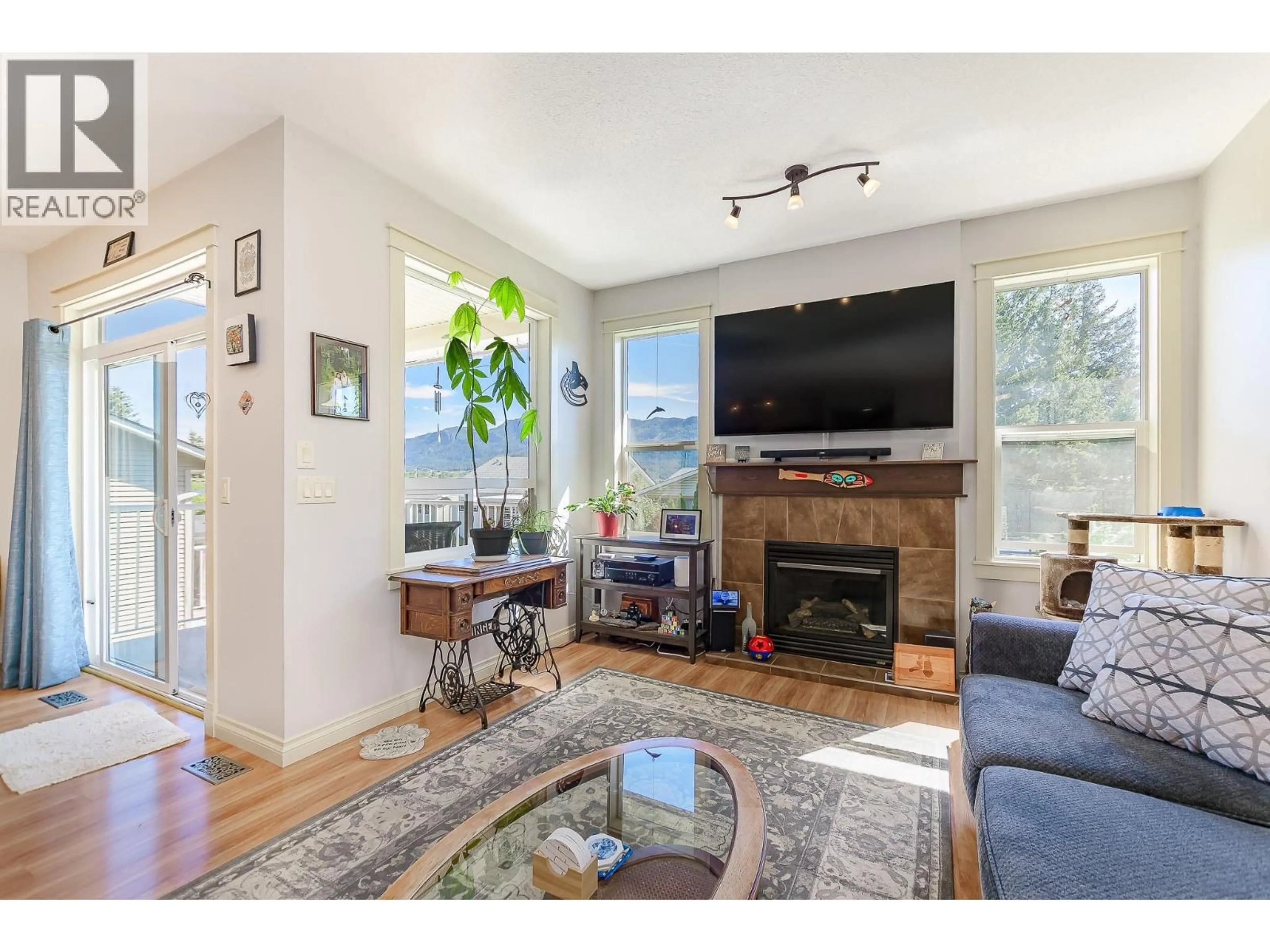 Living room with furniture, wood/laminate floor for 1903 NORTHERN STREET, Enderby British Columbia V0E1V0