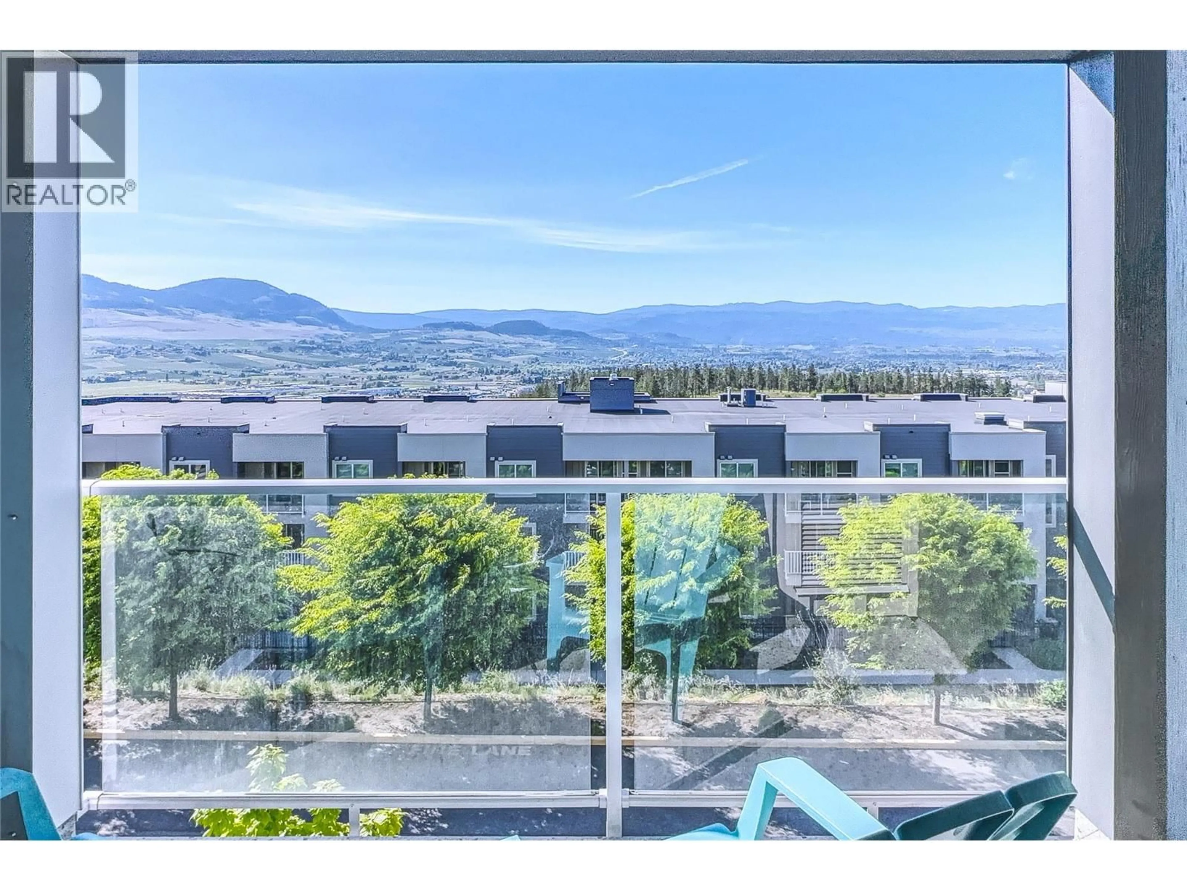A pic from outside/outdoor area/front of a property/back of a property/a pic from drone, mountain view for PH5 - 725 ACADEMY WAY, Kelowna British Columbia V1V0B4