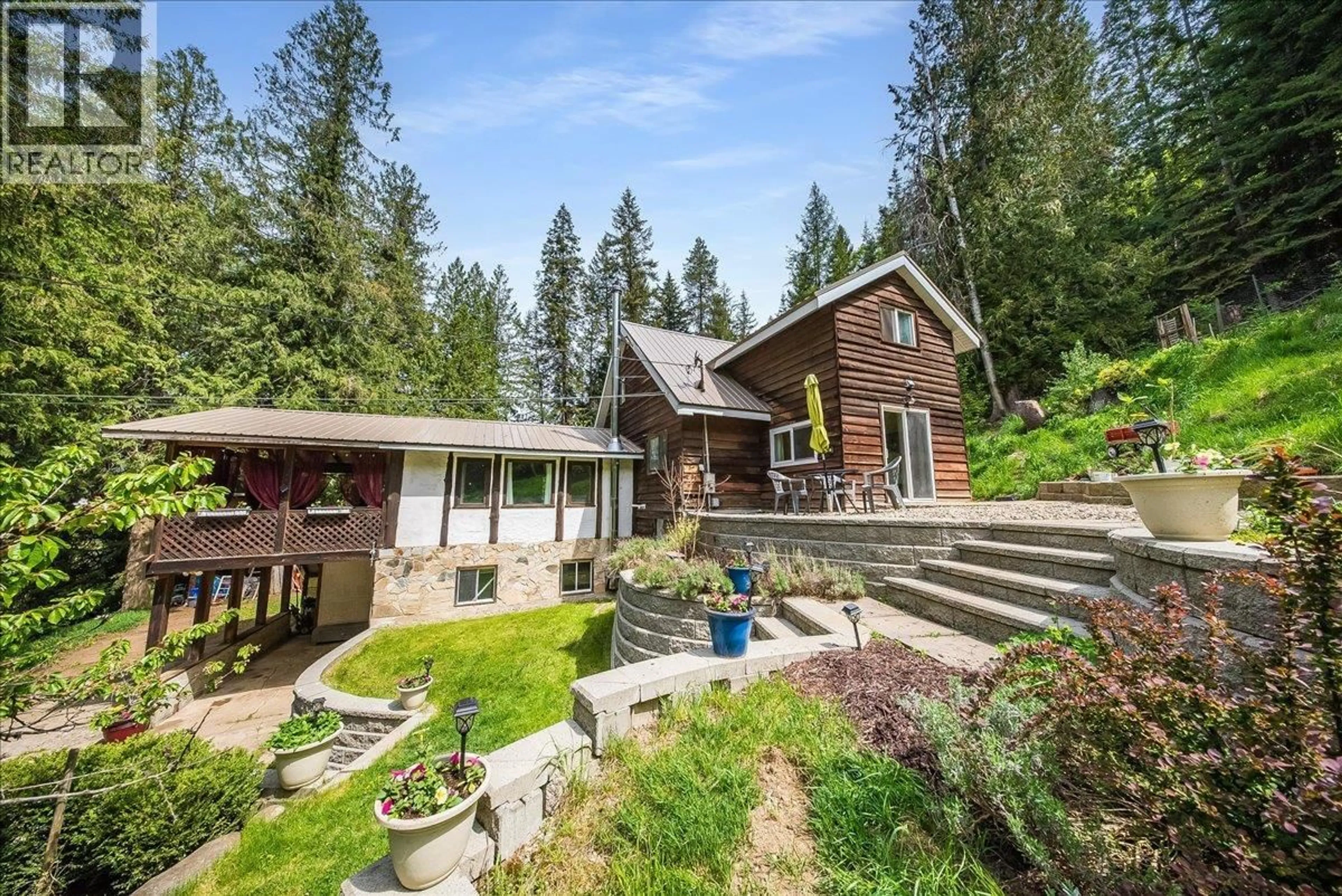 A pic from outside/outdoor area/front of a property/back of a property/a pic from drone, unknown for 2280 OLD SALMO ROAD, Fruitvale British Columbia V0G1L1