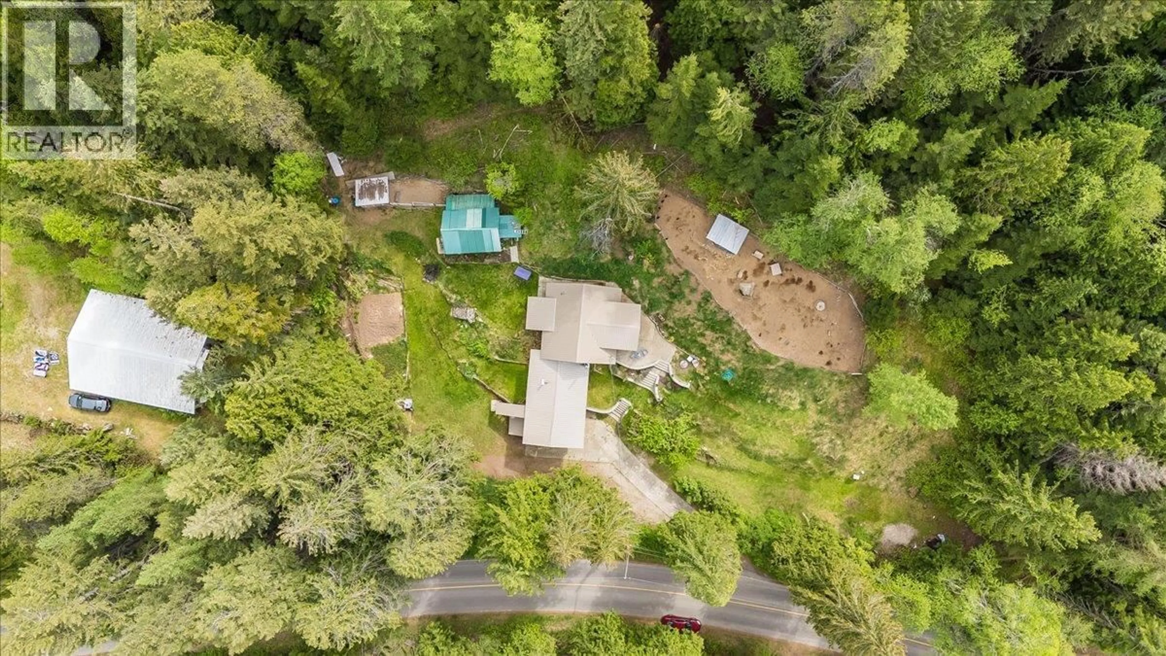 A pic from outside/outdoor area/front of a property/back of a property/a pic from drone, forest/trees view for 2280 OLD SALMO ROAD, Fruitvale British Columbia V0G1L1