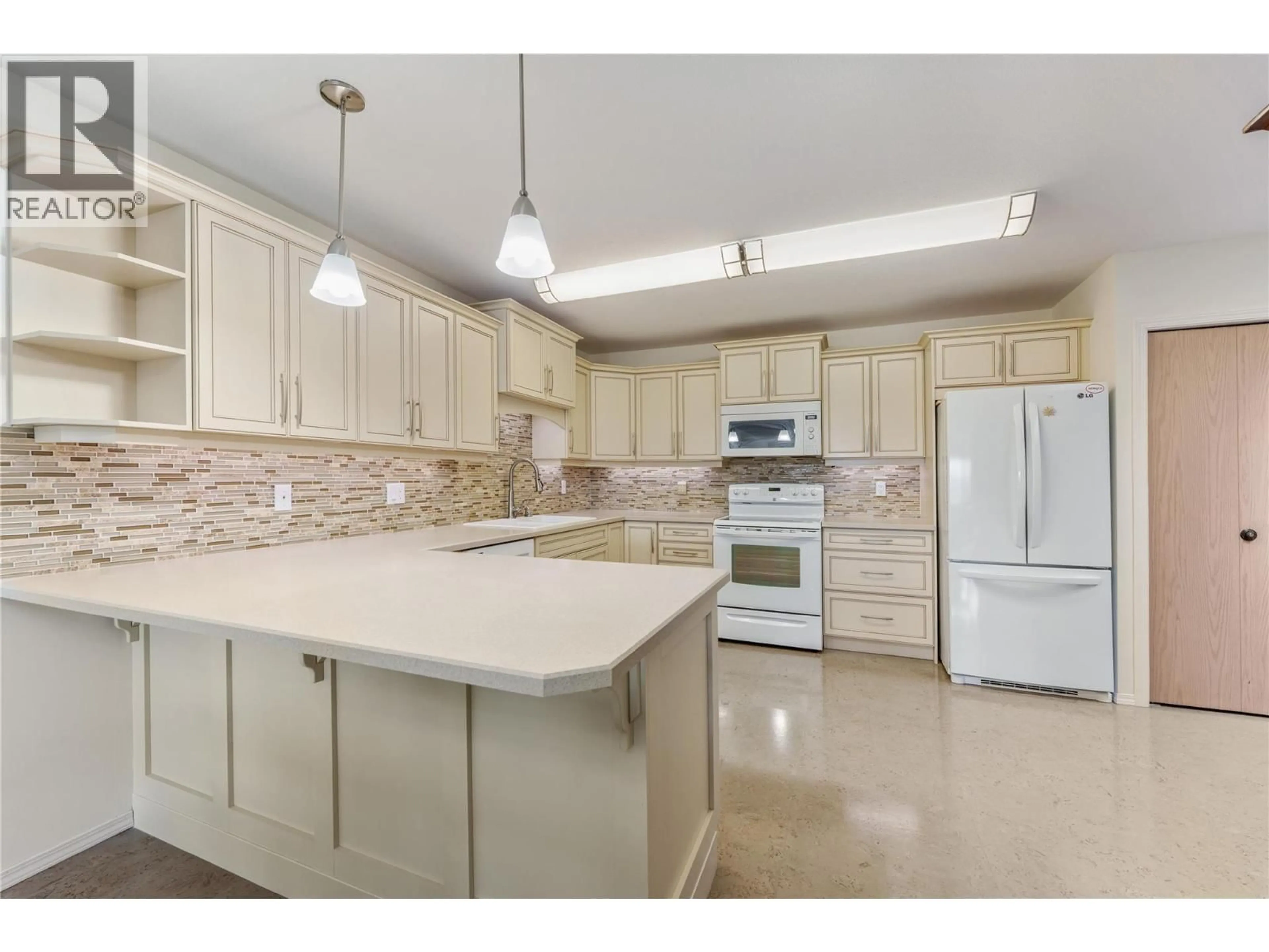 Open concept kitchen, ceramic/tile floor for 310 - 2477 INGRAM ROAD, West Kelowna British Columbia V4T1W7